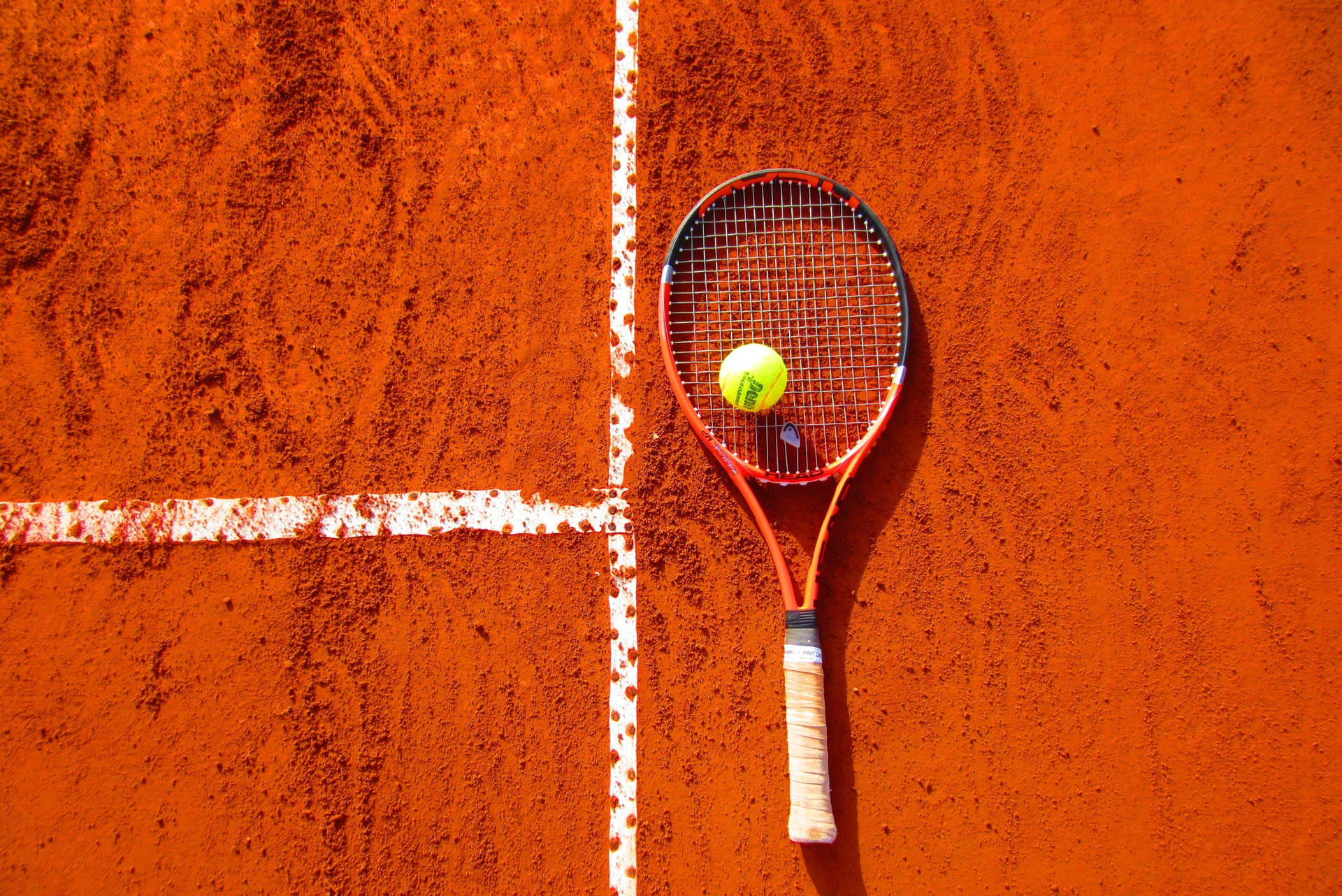 Squash Racket On Orange Floor Background