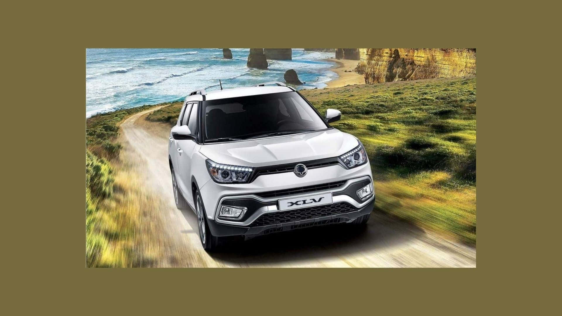 Ssangyong luxury SUV on scenic road Wallpaper