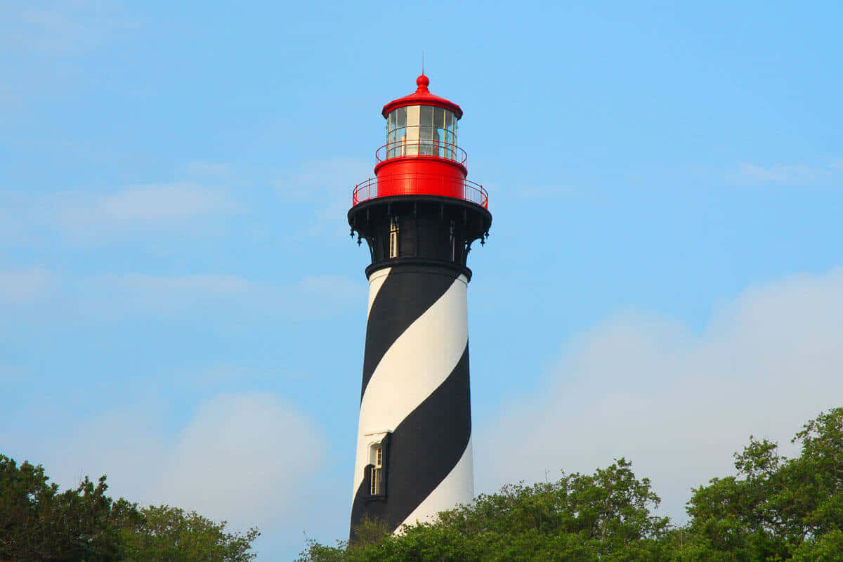 A Lighthouse With A Black And White Stripe