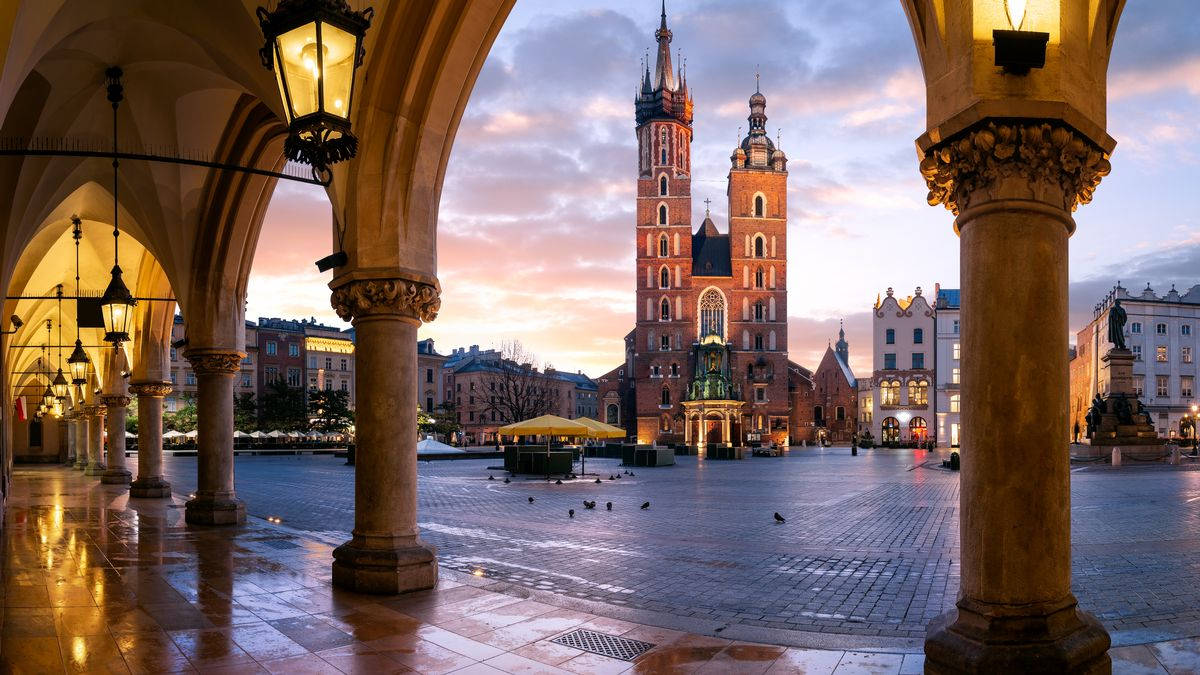 St. Mary's Basilica Viewed From Krakow Cloth Hall In Poland Wallpaper