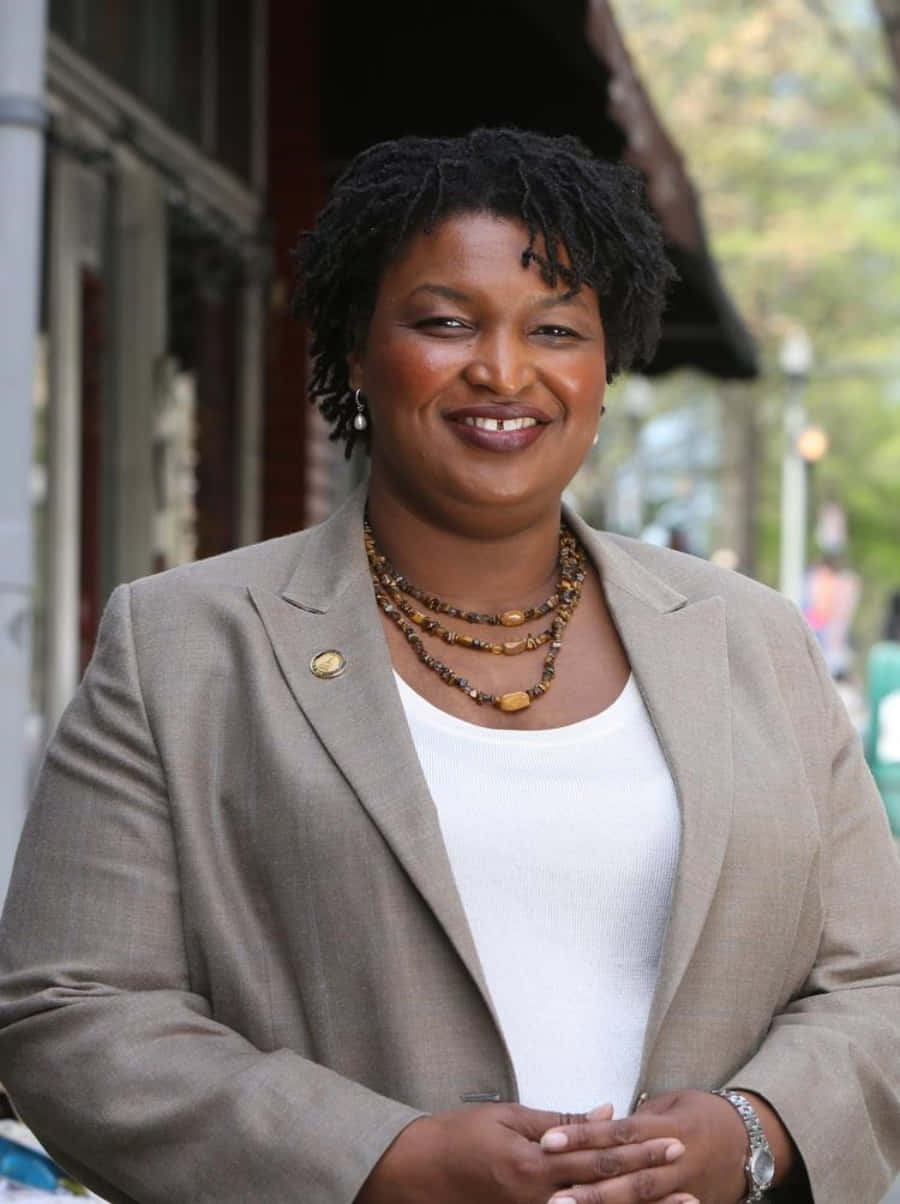Stacey Abrams Delivering A Speech Wallpaper