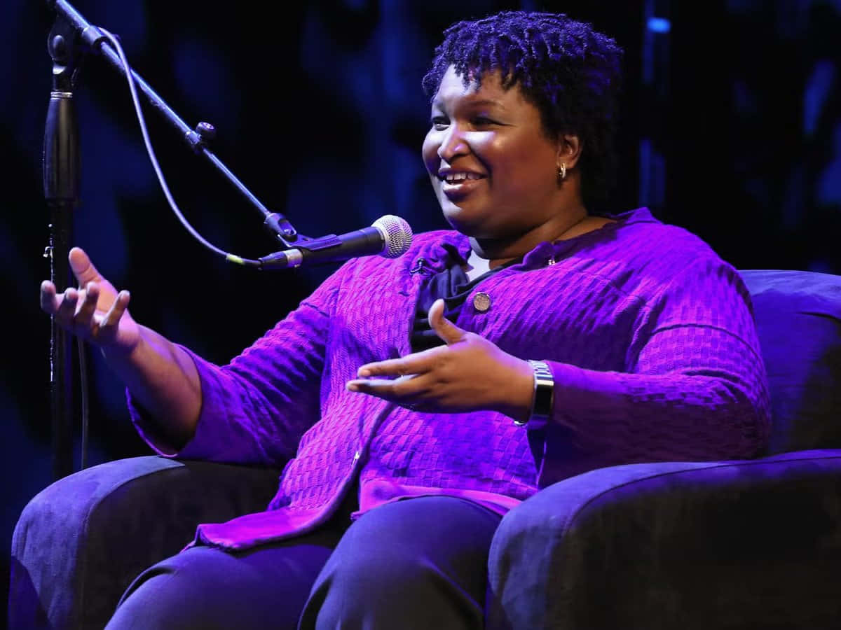 Stacey Abrams Smiling At The Audience Wallpaper