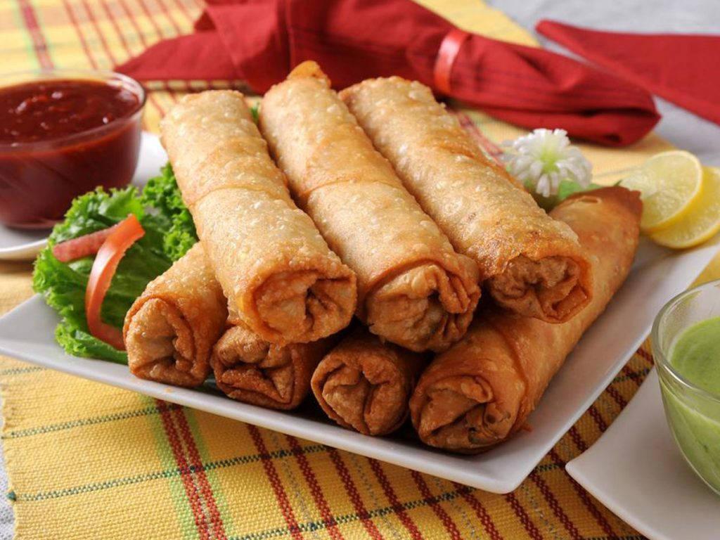 Stack Of Egg Rolls With Ketchup Dip