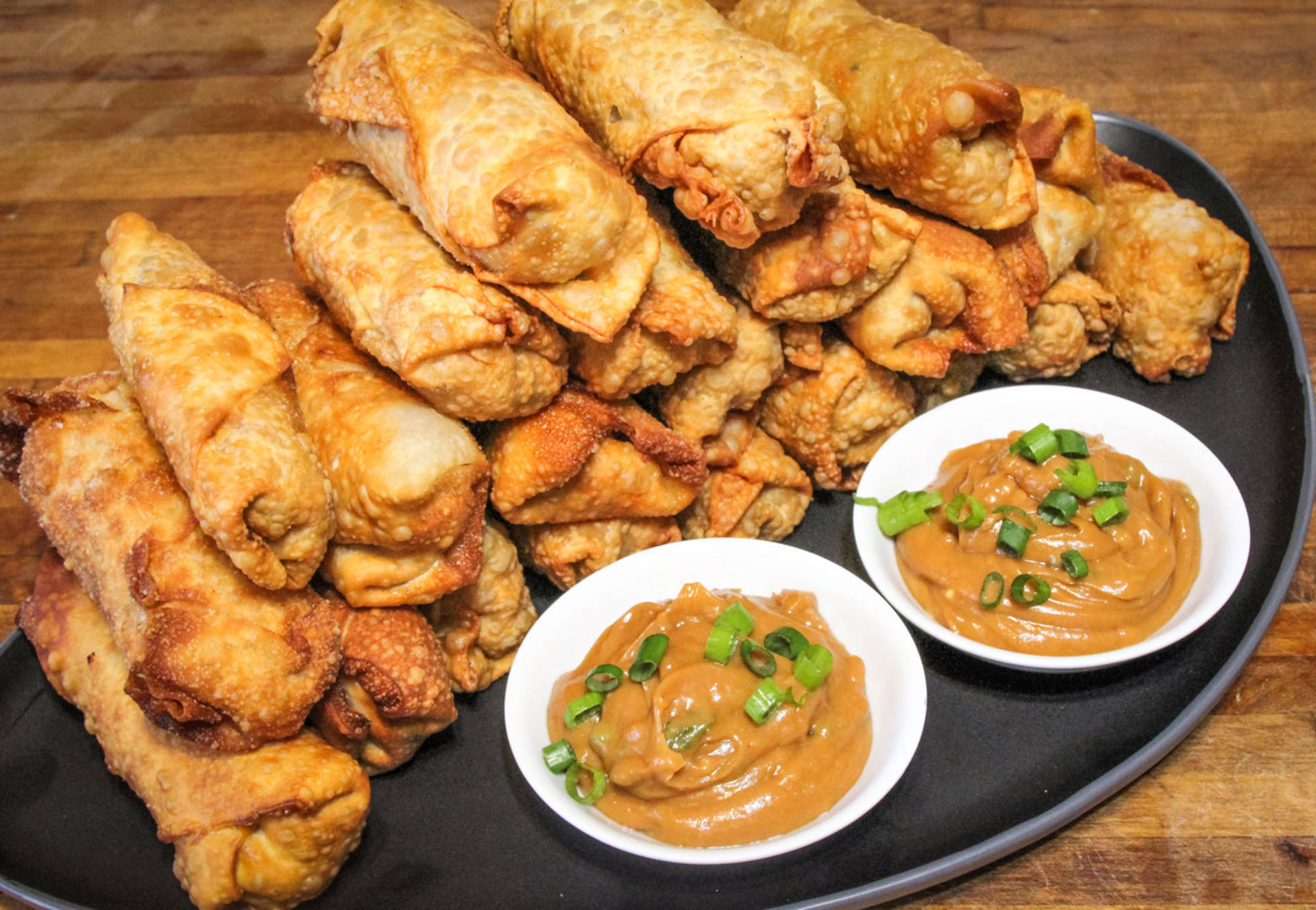 Stack Of Egg Rolls With Peanut Sauce