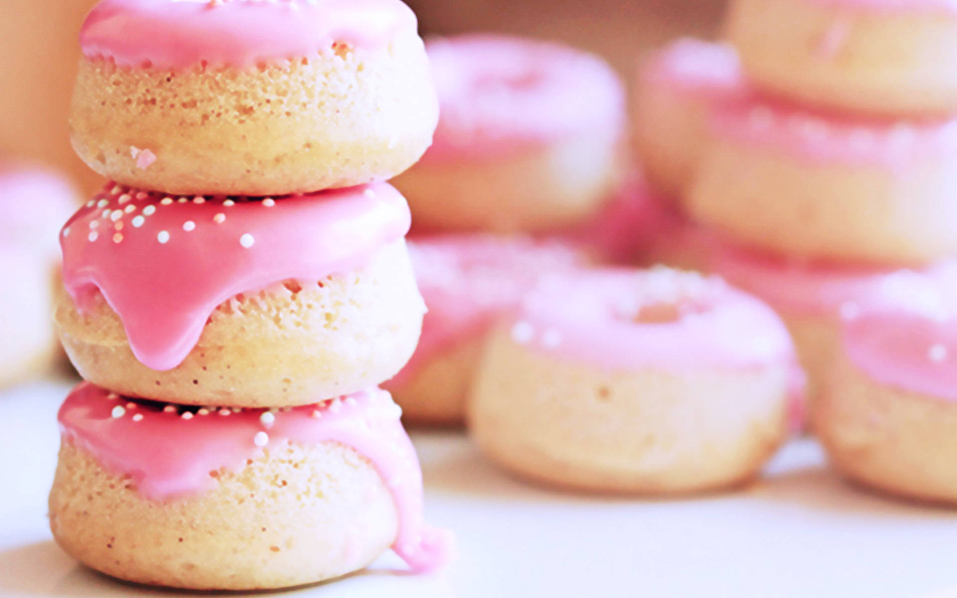 Stacked Pink Mini Donuts Wallpaper