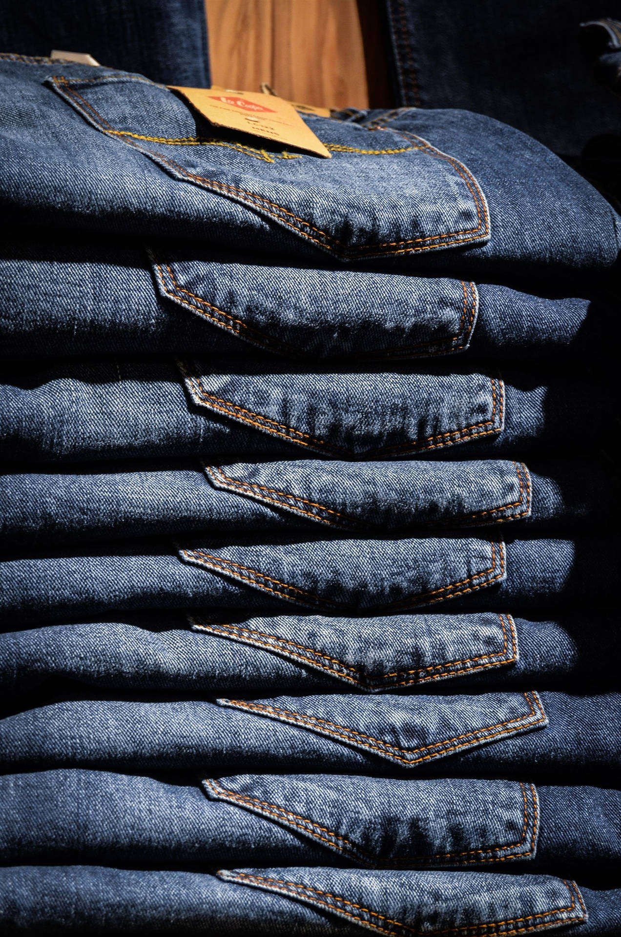 Stacked Uniformed Blue Jeans Background