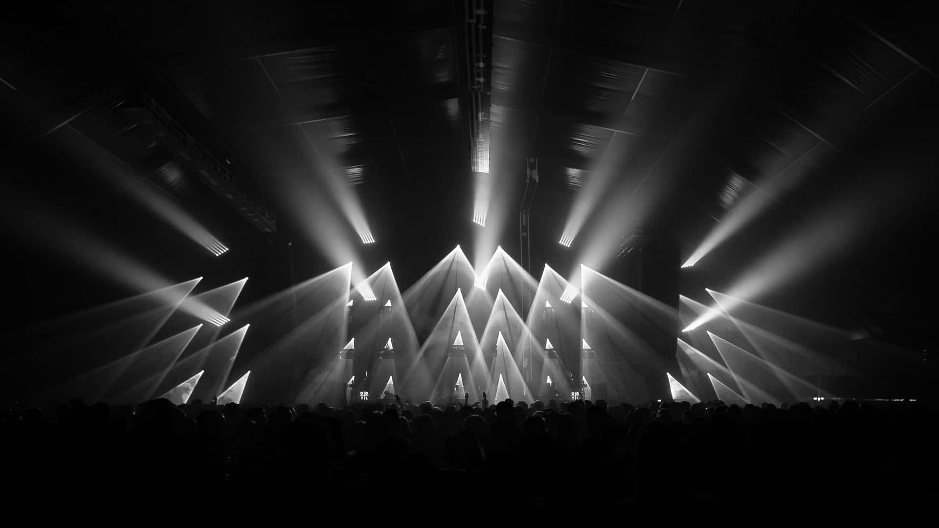 Huge Stage With Bright Lights In Monochrome Background
