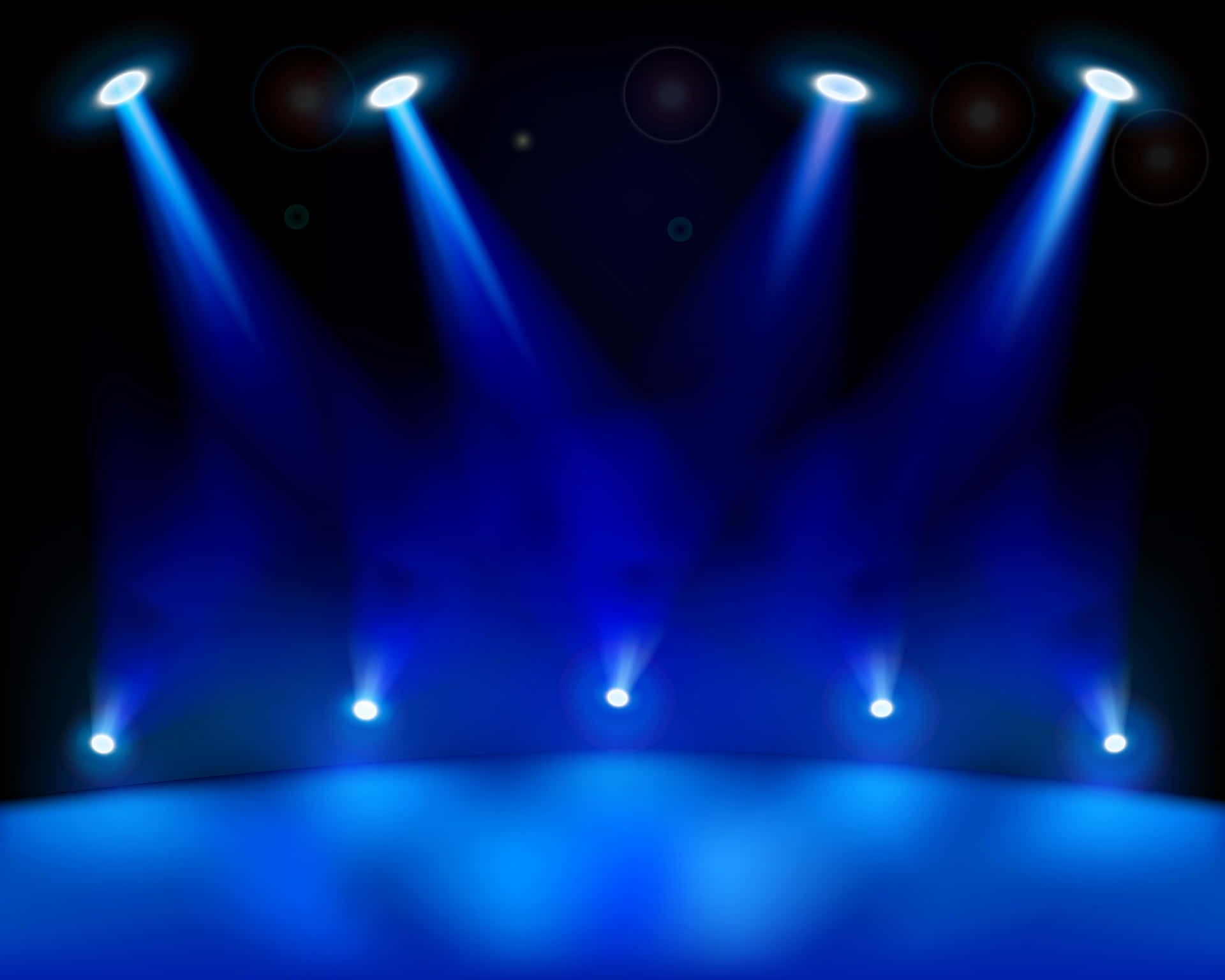 Bright stage lights illuminating a live performance