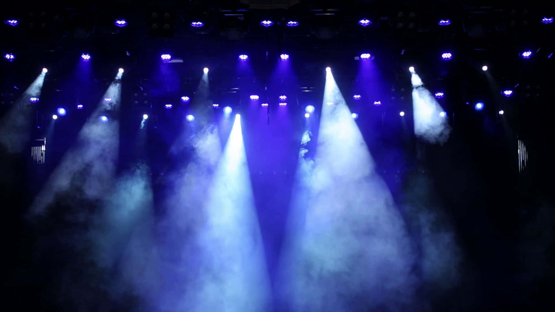 A mesmerizing view of bright stage lights inside of a concert hall
