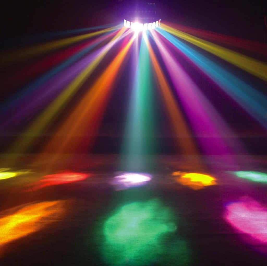 A Colorful Light Beam Is Shown In The Dark
