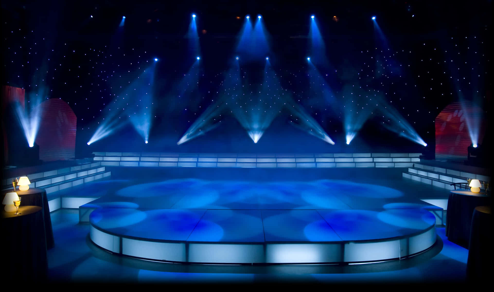 A Stage With Blue Lights And A Stage Set