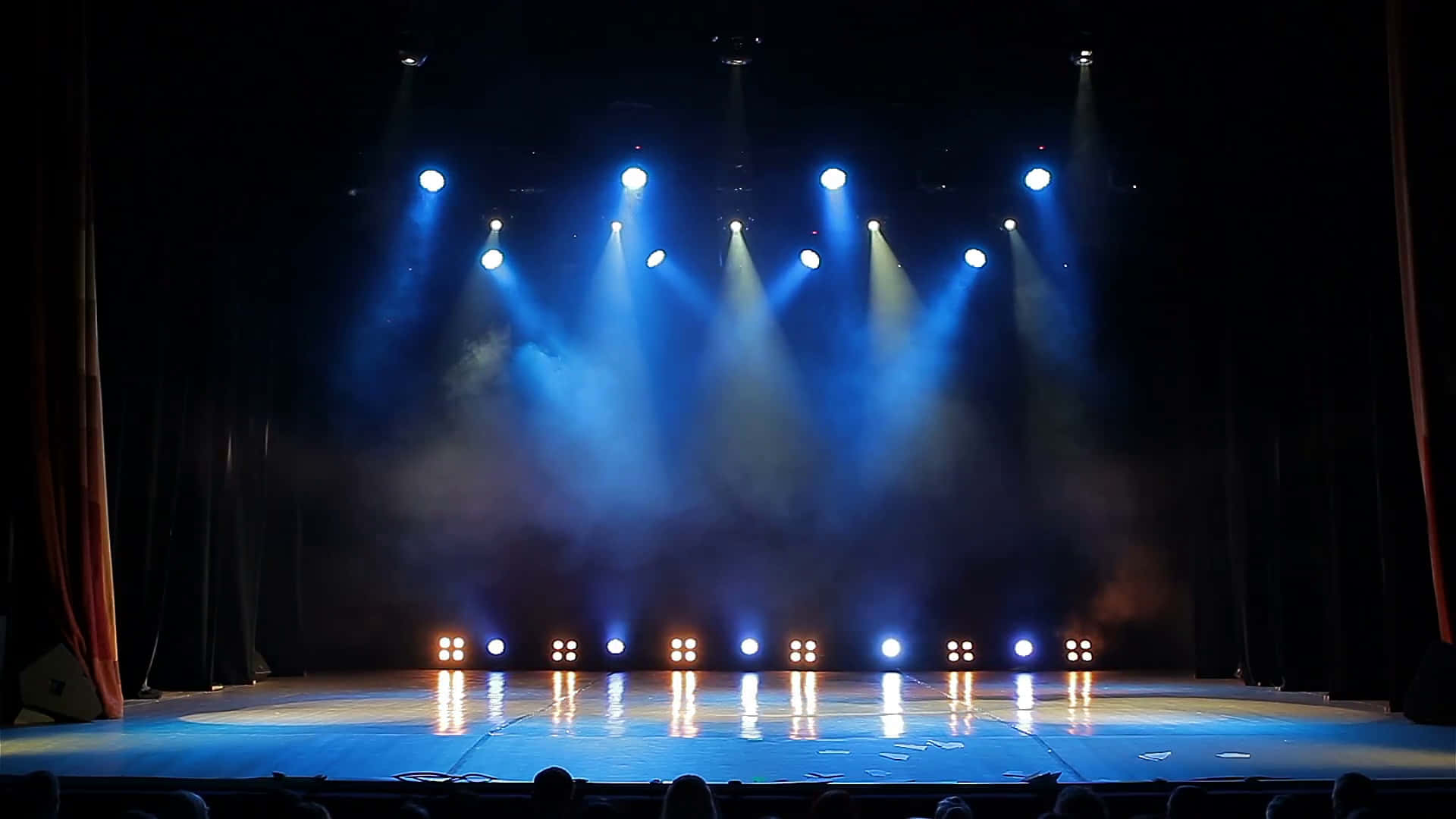 A Stage With Blue Lights And A Stage
