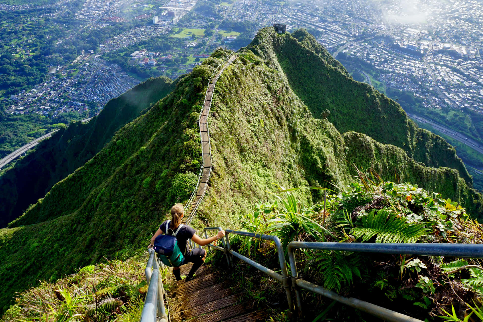 A breathtaking view of the Stairway to Heaven trail amidst lush greenery and misty mountains