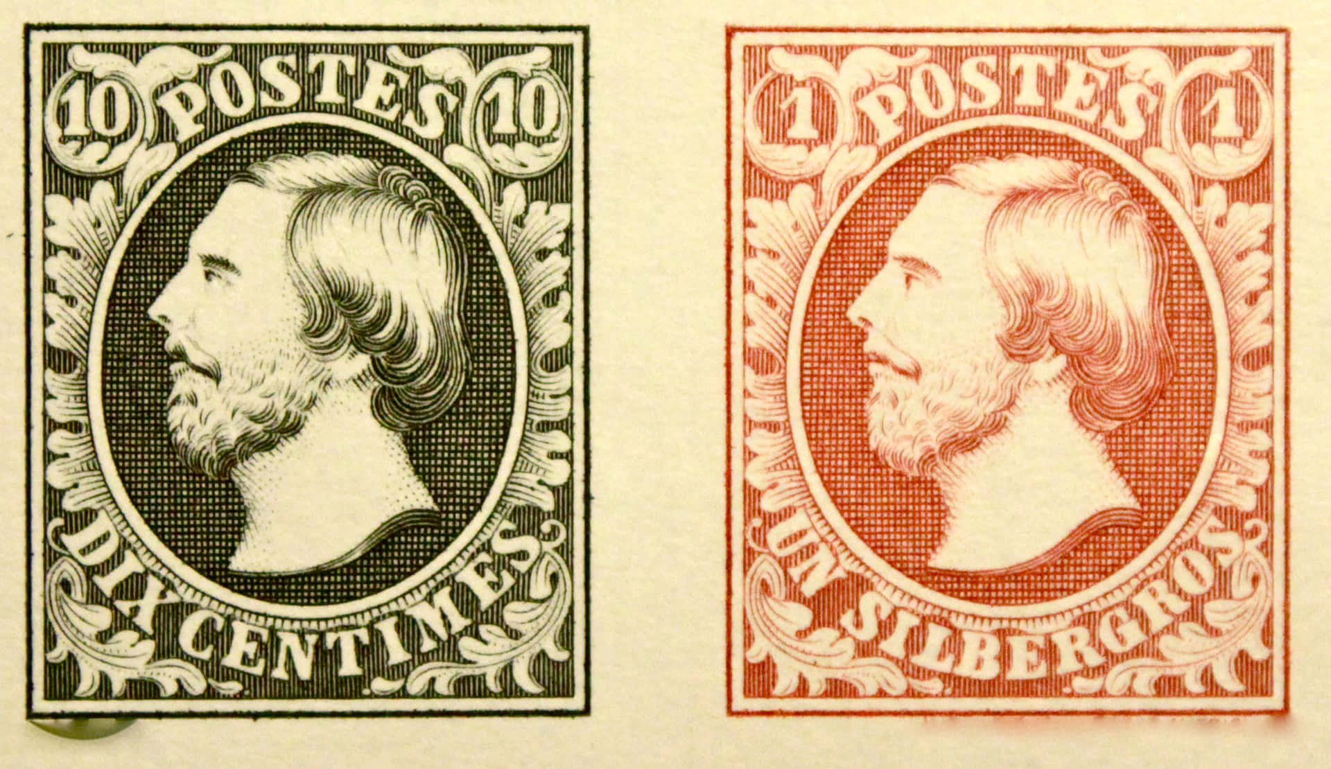 A Pair Of Stamps With A Man's Face On Them