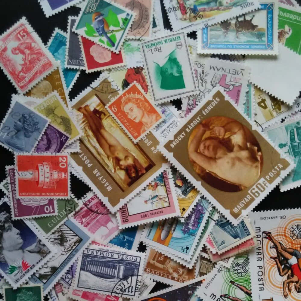 A Pile Of Stamps With Different Designs On Them