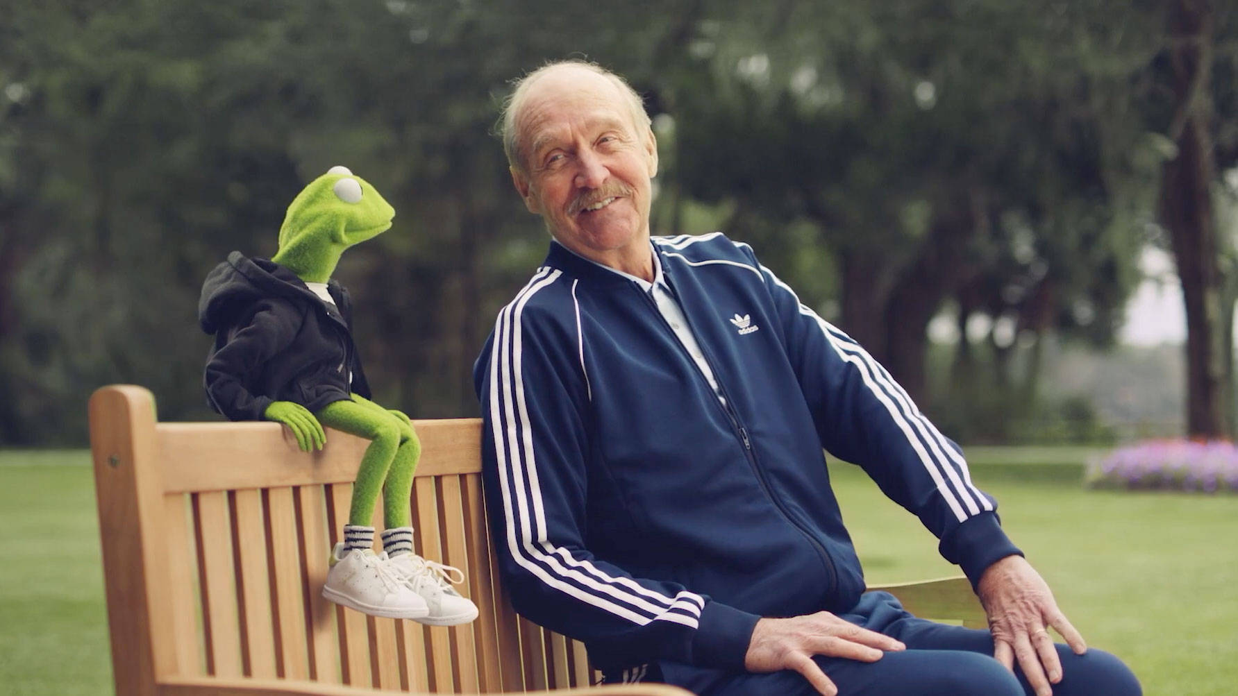 Stan Smith Sitting In The Bench Wallpaper