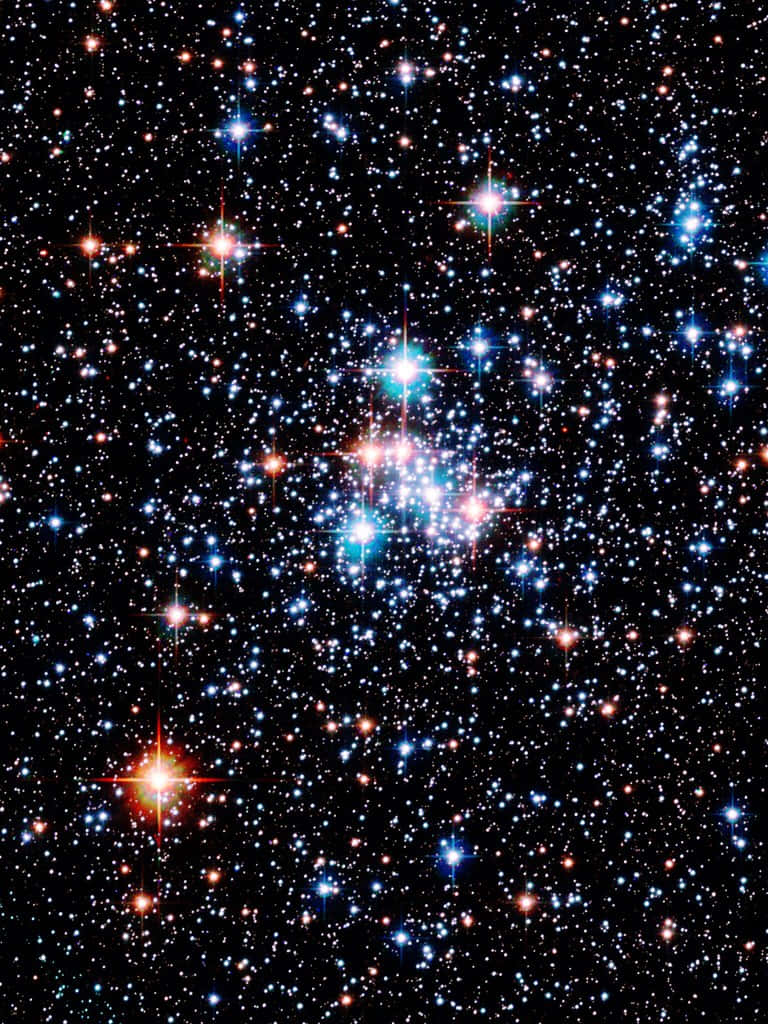 Dazzling Star Cluster in the Night Sky Wallpaper