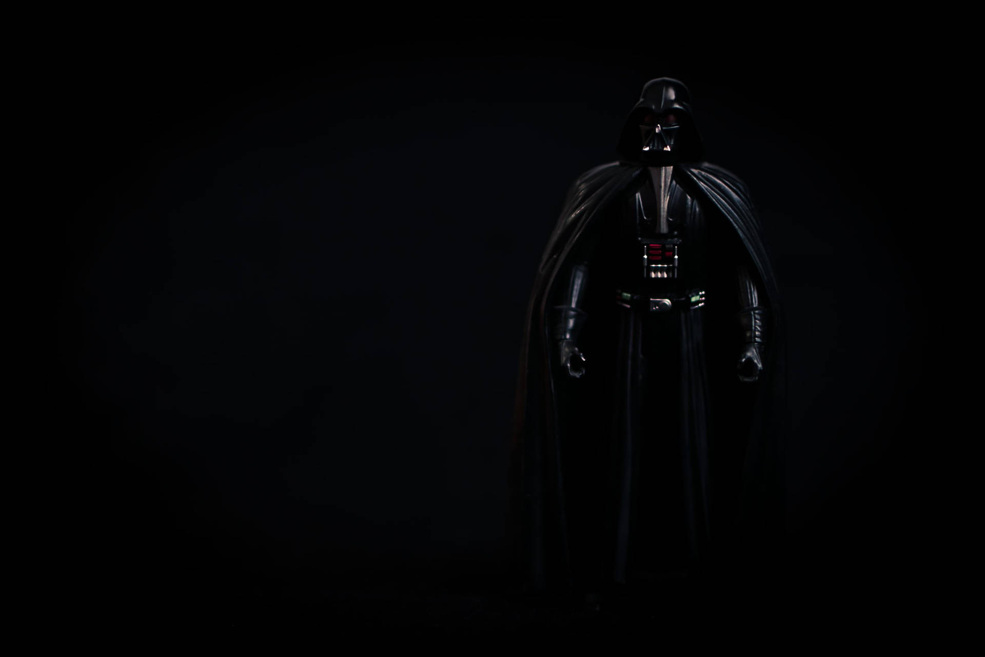 Sith Lord Darth Vader looms in the darkness Wallpaper