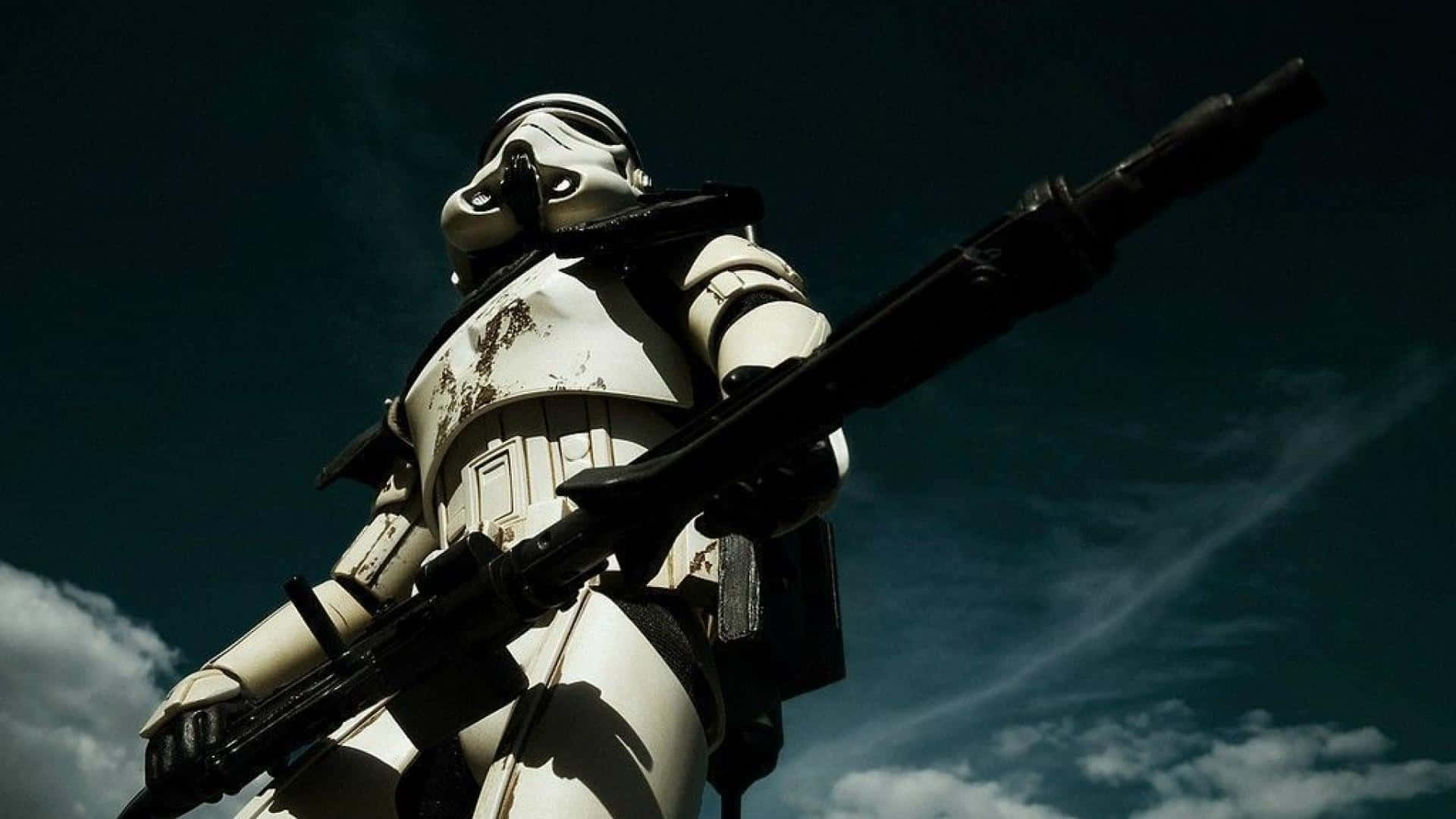 a stormtrooper is standing in the sky with a rifle Wallpaper
