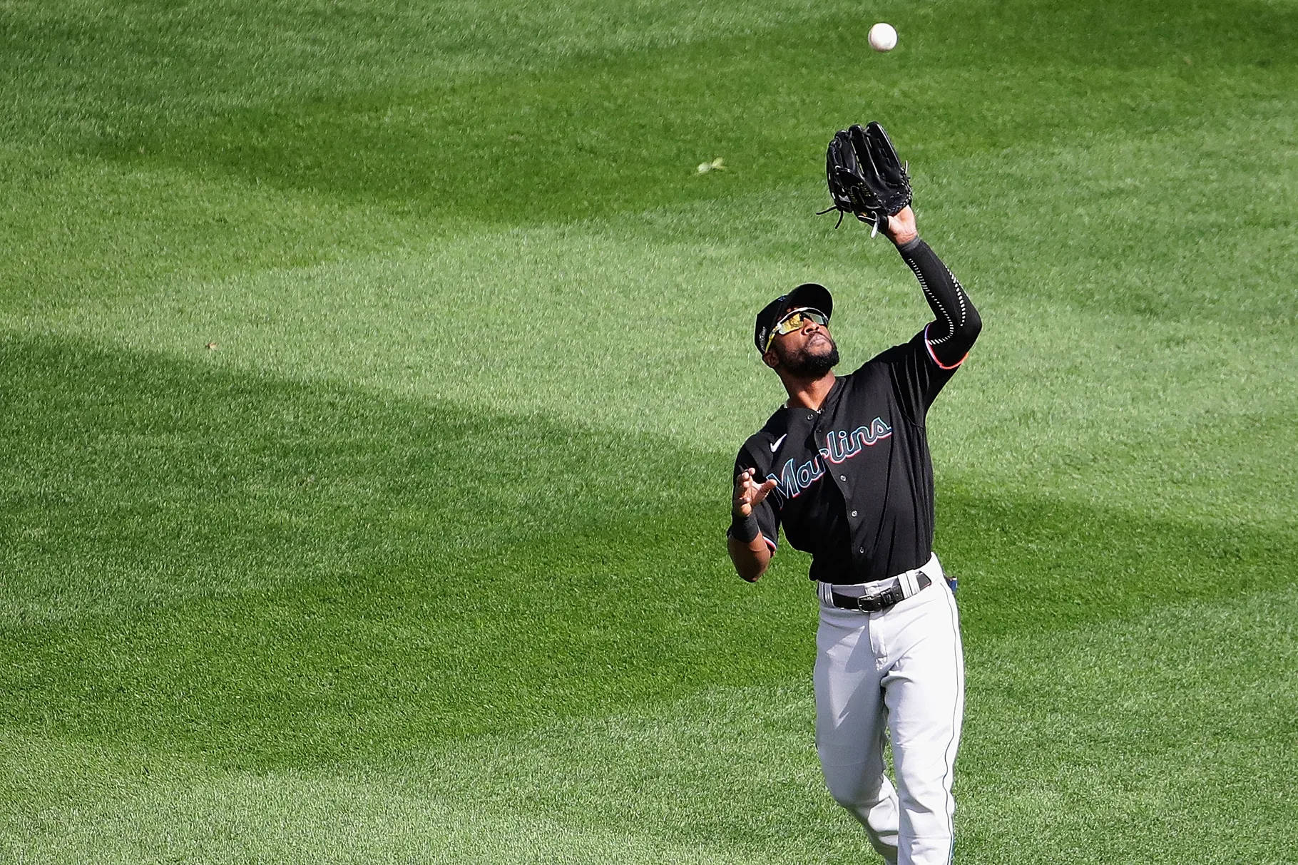 Starling Marte Catching Baseball On Field Wallpaper