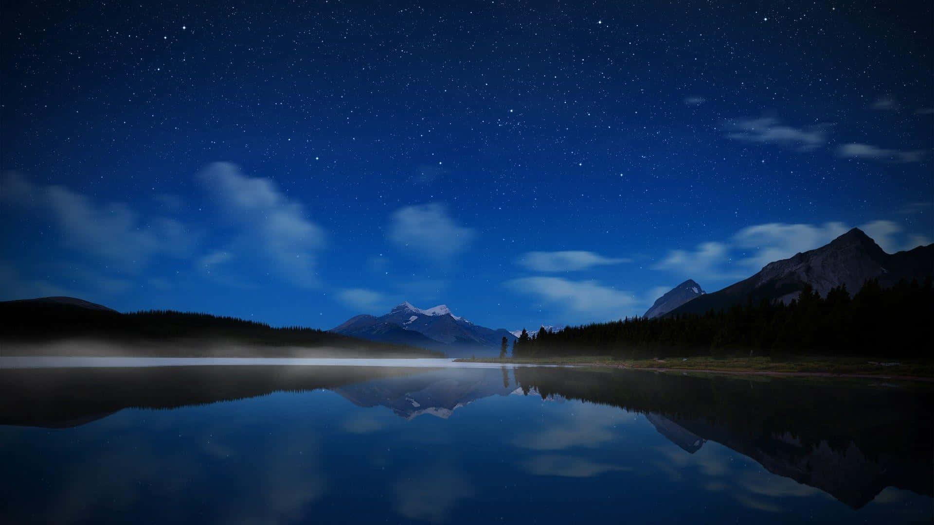 Starry Night Over Mountain Lake Wallpaper