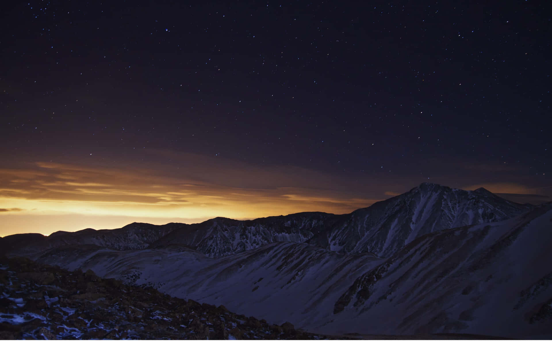 Starry_ Night_ Over_ Snowy_ Mountains.jpg Wallpaper