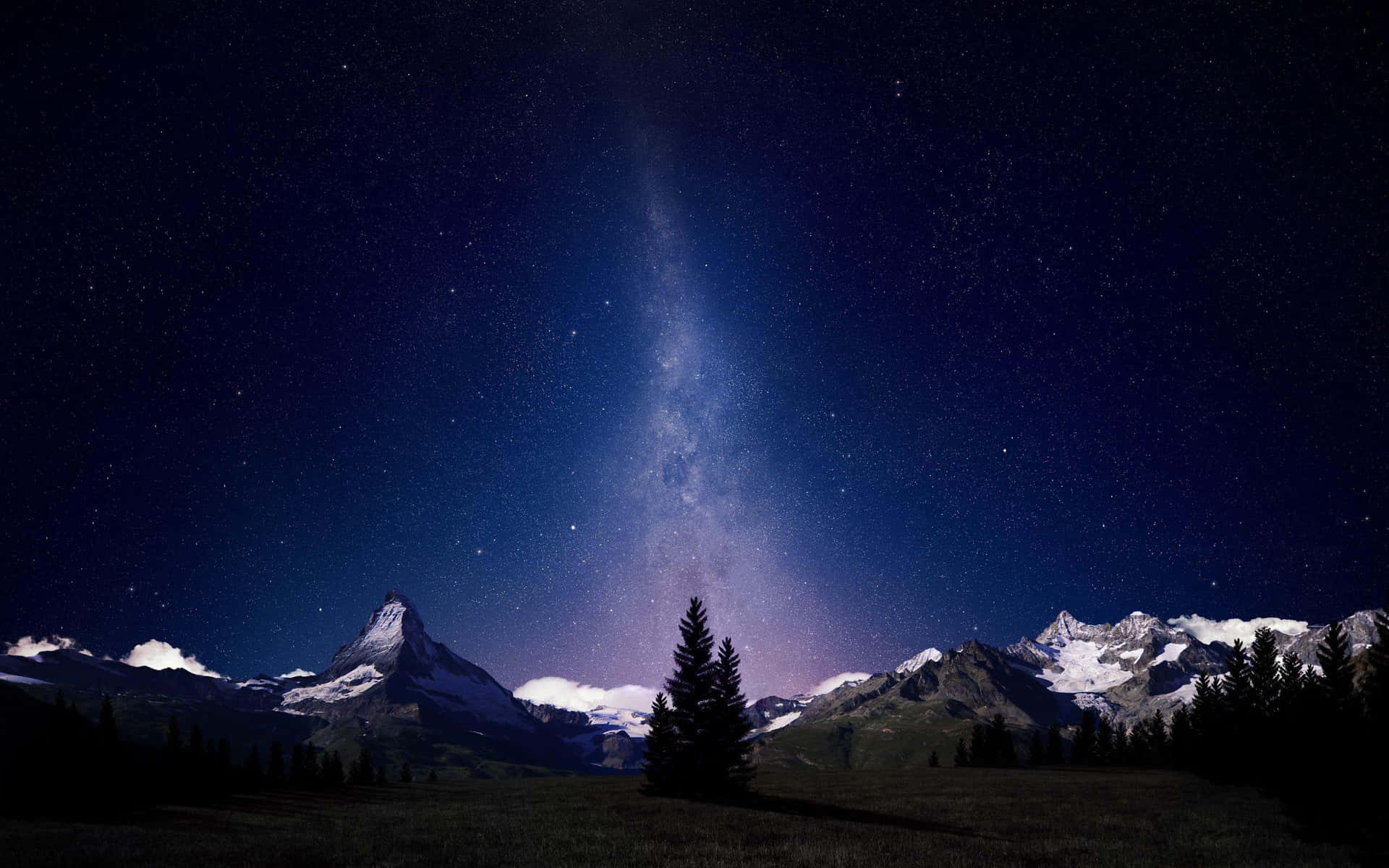 Starry_ Night_ Over_ Snowy_ Mountains.jpg Wallpaper