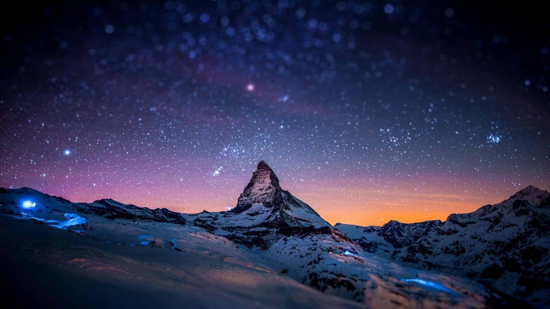 A Mountain With Stars Above It Wallpaper