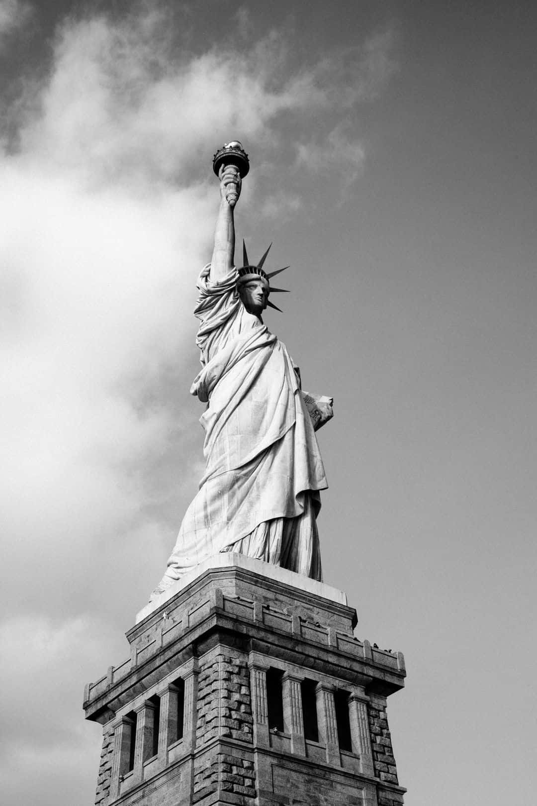 The Statue Of Liberty Is Shown In Black And White