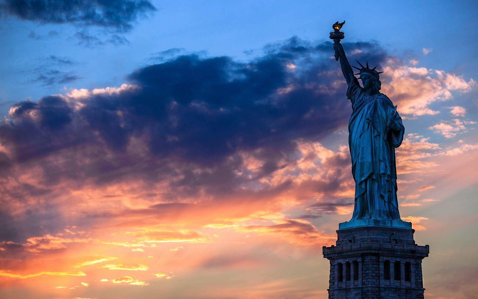 Statue Of Liberty Sunset Clouds Wallpaper
