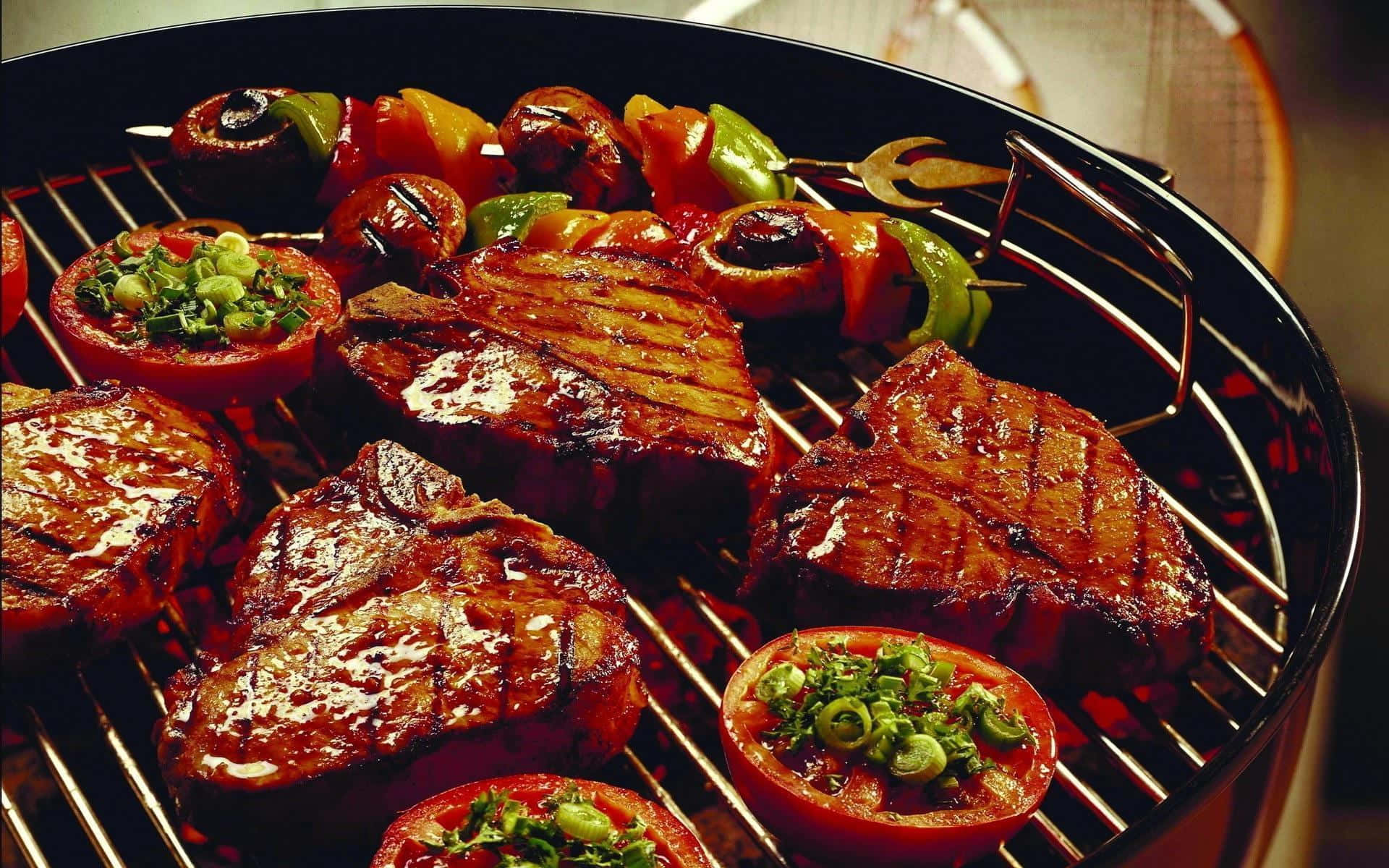 A Grill With Meat And Vegetables On It