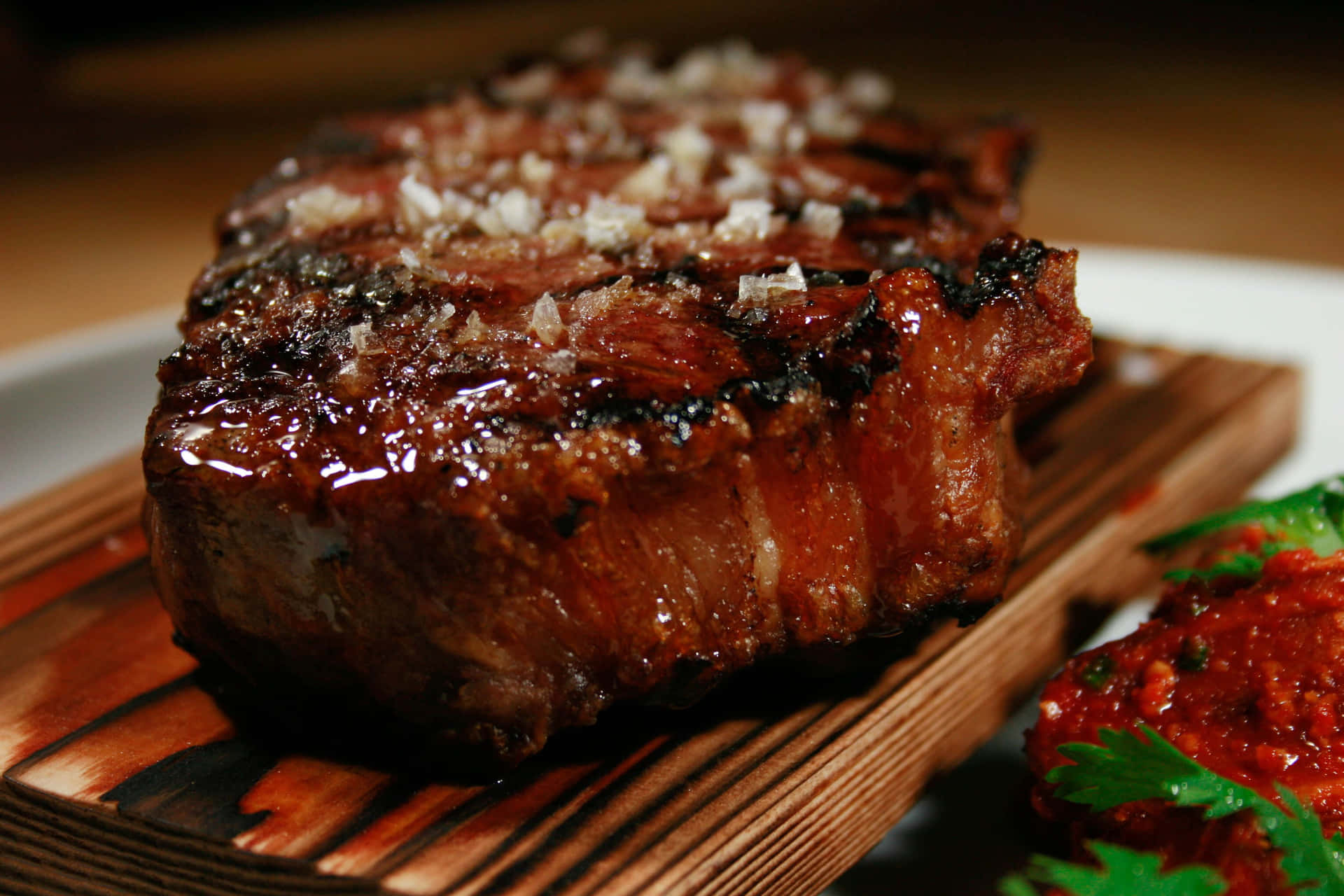 A Steak On A Wooden Board