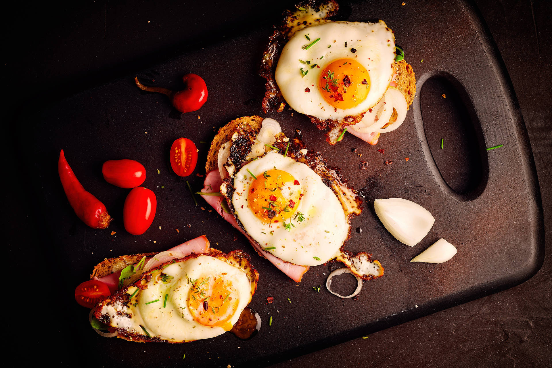 Captivating Picture of Gourmet Steak Tartare Garnished with Egg Yolk Wallpaper