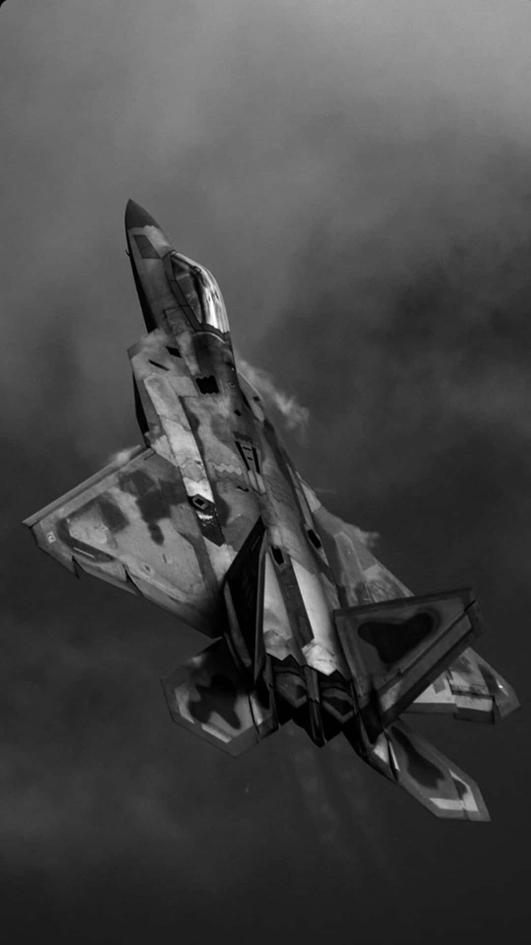 Stealth_ Fighter_ Ascending_ Through_ Clouds Wallpaper