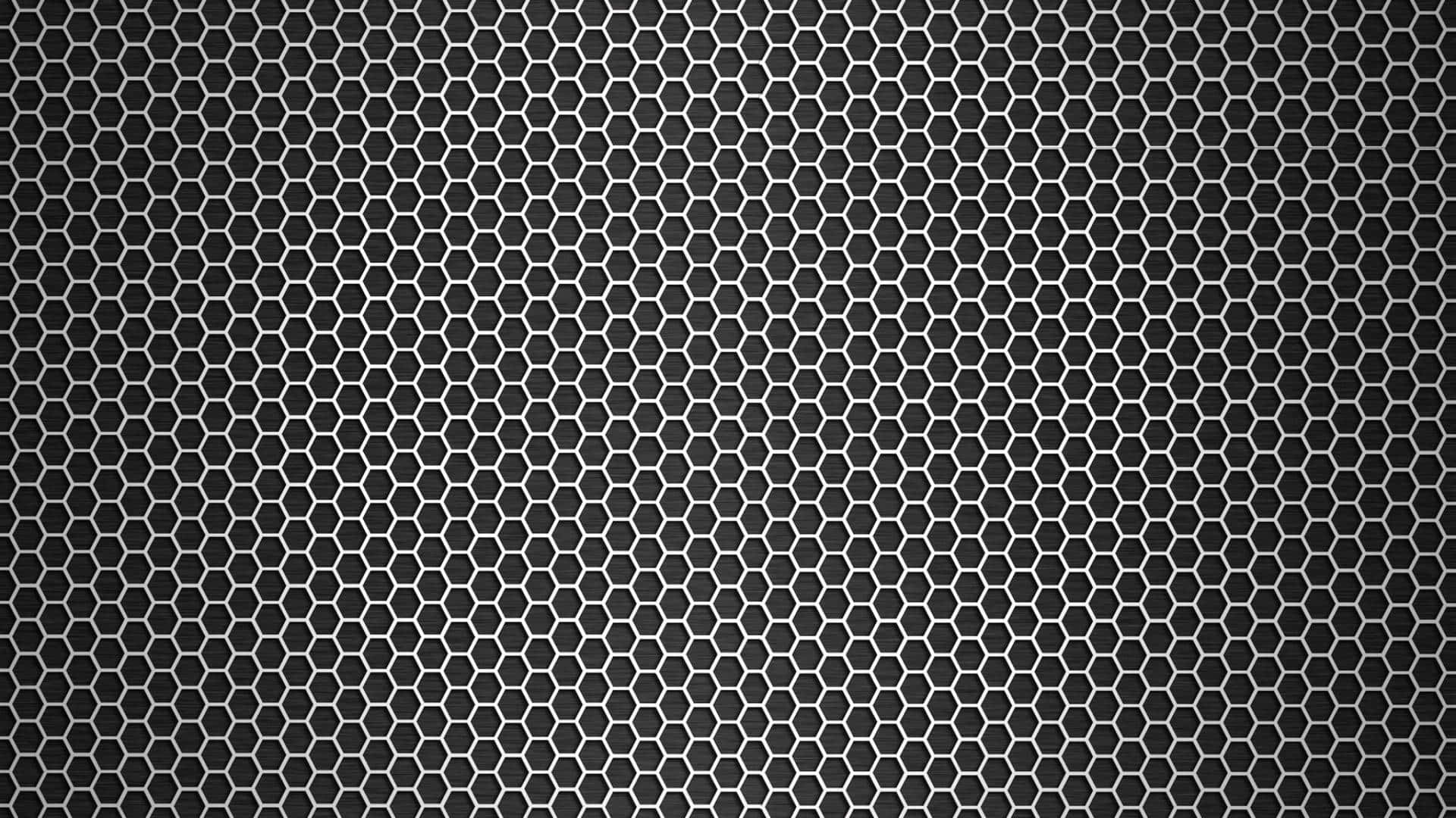 A Black Metal Mesh Background With Holes
