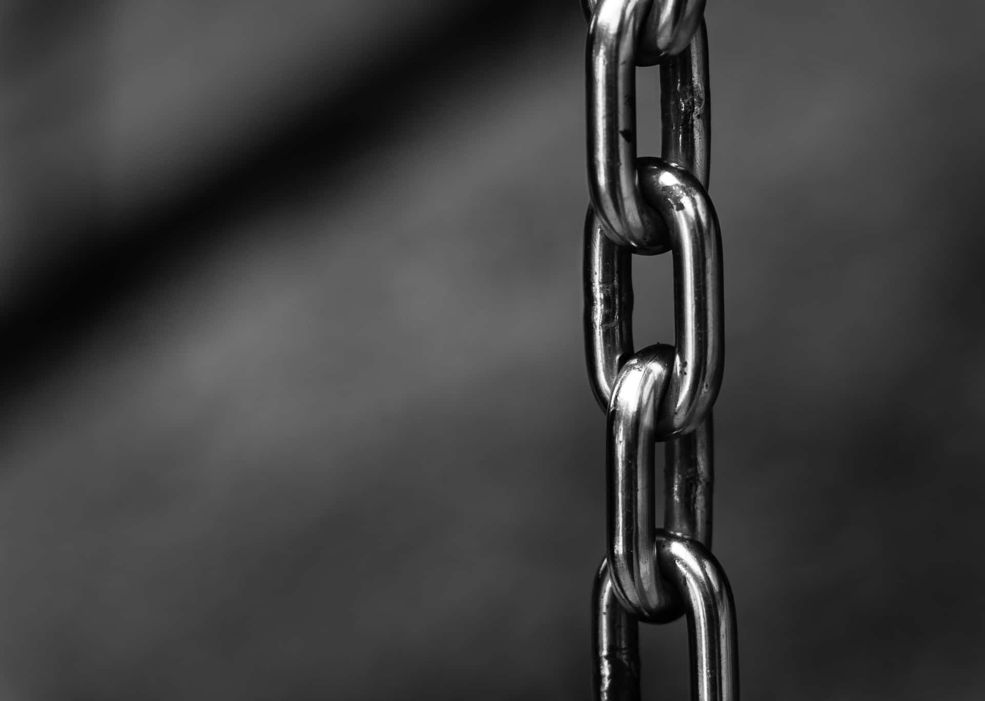 A Chain With A Black Background Wallpaper