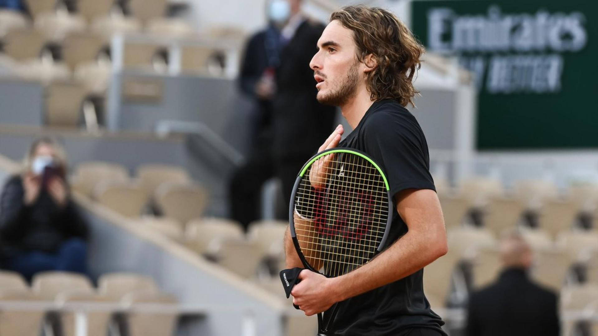 Stefanos Tsitsipas With Hand On Chest Wallpaper