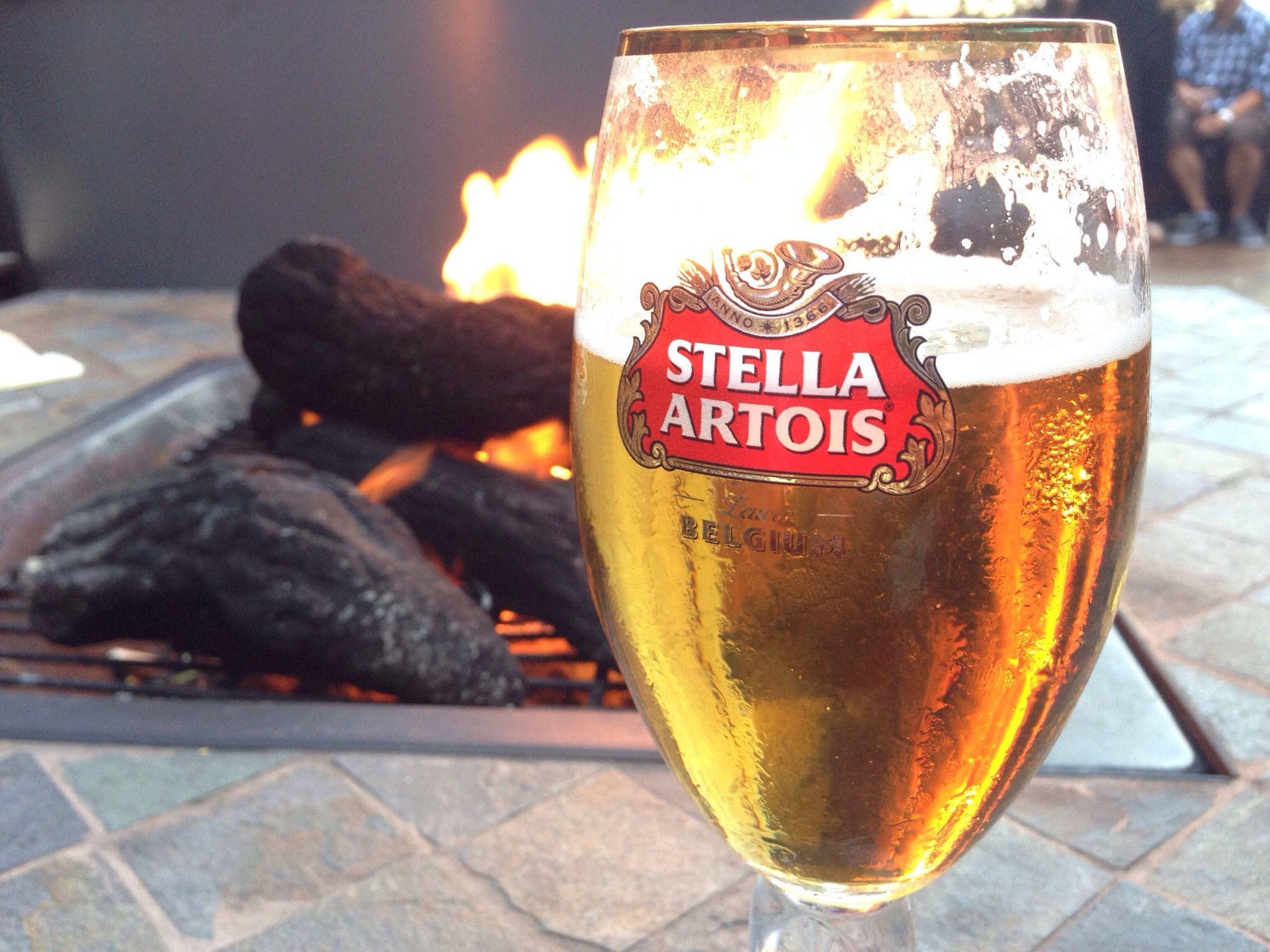 Stella Artois Beer By The Fireplace Wallpaper