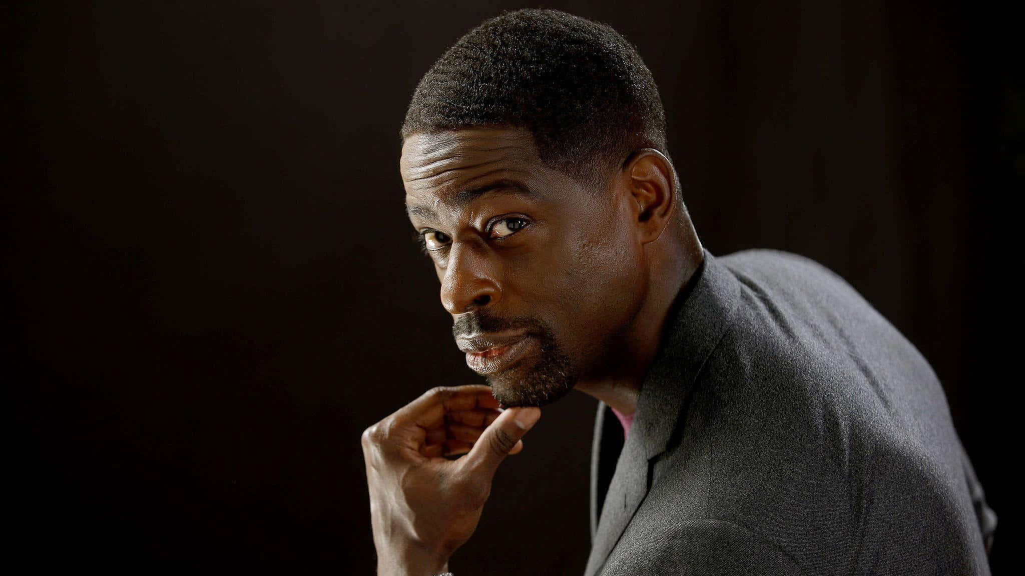 Hollywood Actor Sterling K Brown in a reflective pose Wallpaper