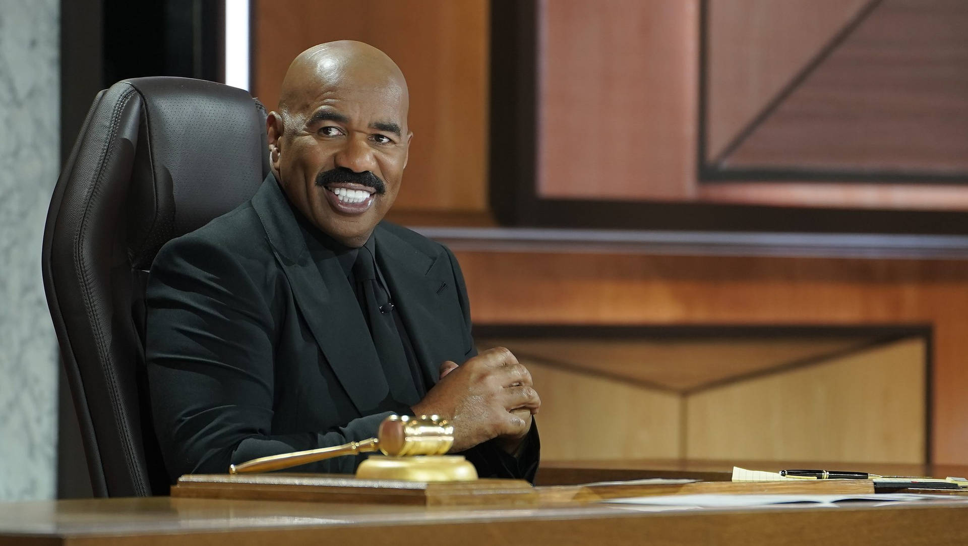 Steve Harvey In A Black Suit With Gavel Picture