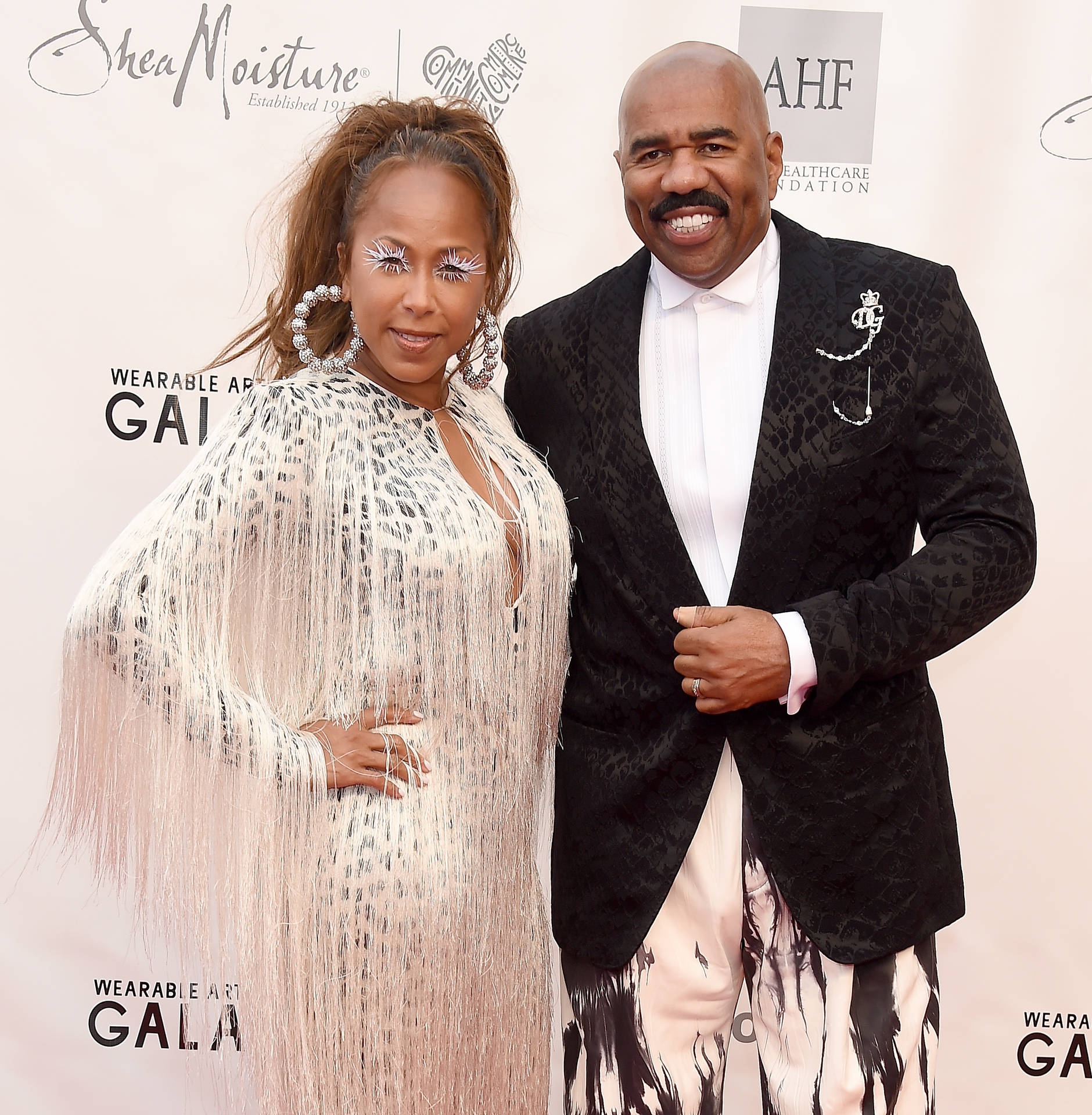 Steve Harvey Posing With His Wife Picture