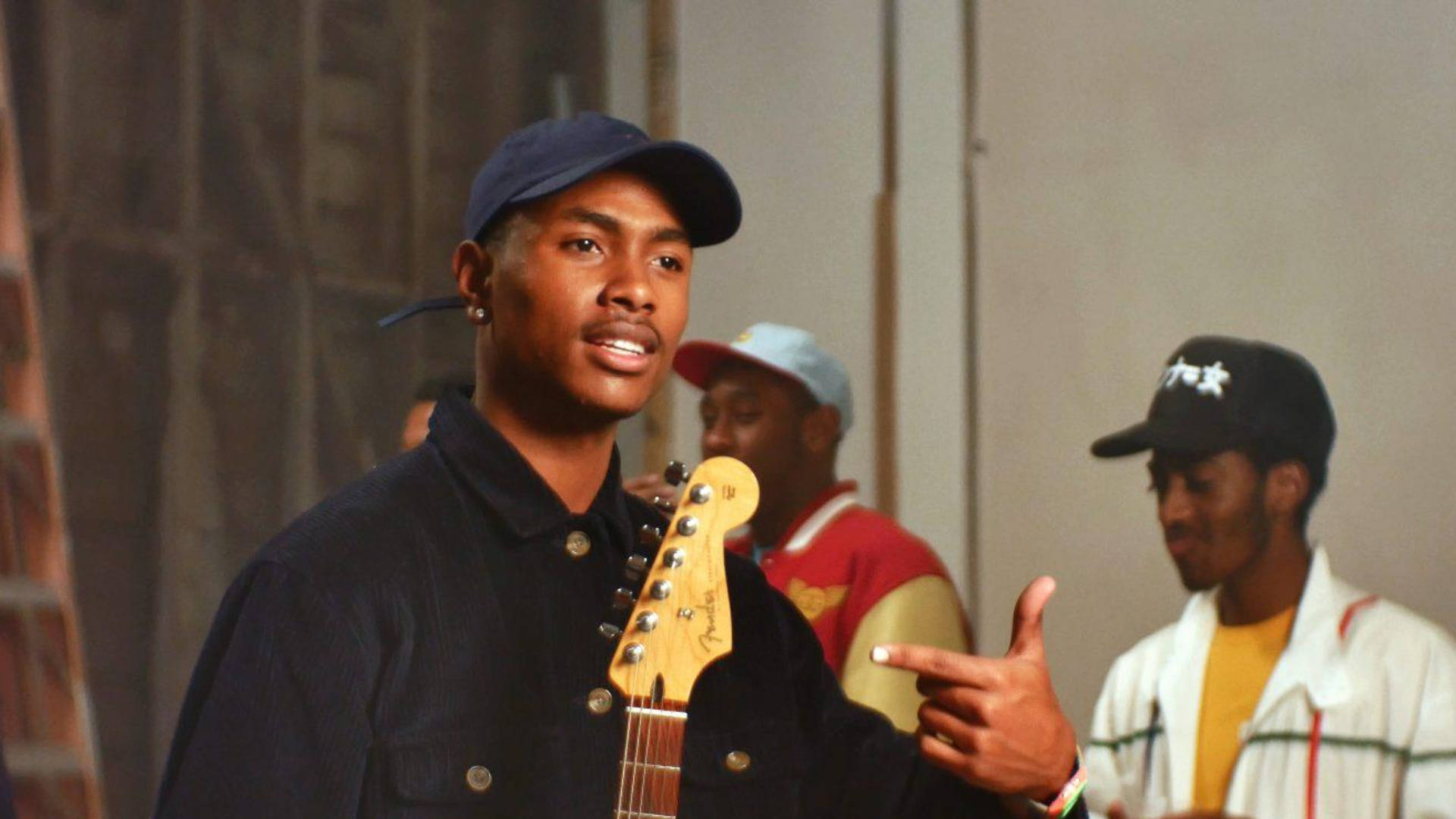 Steve Lacy Singing While Holding Guitar