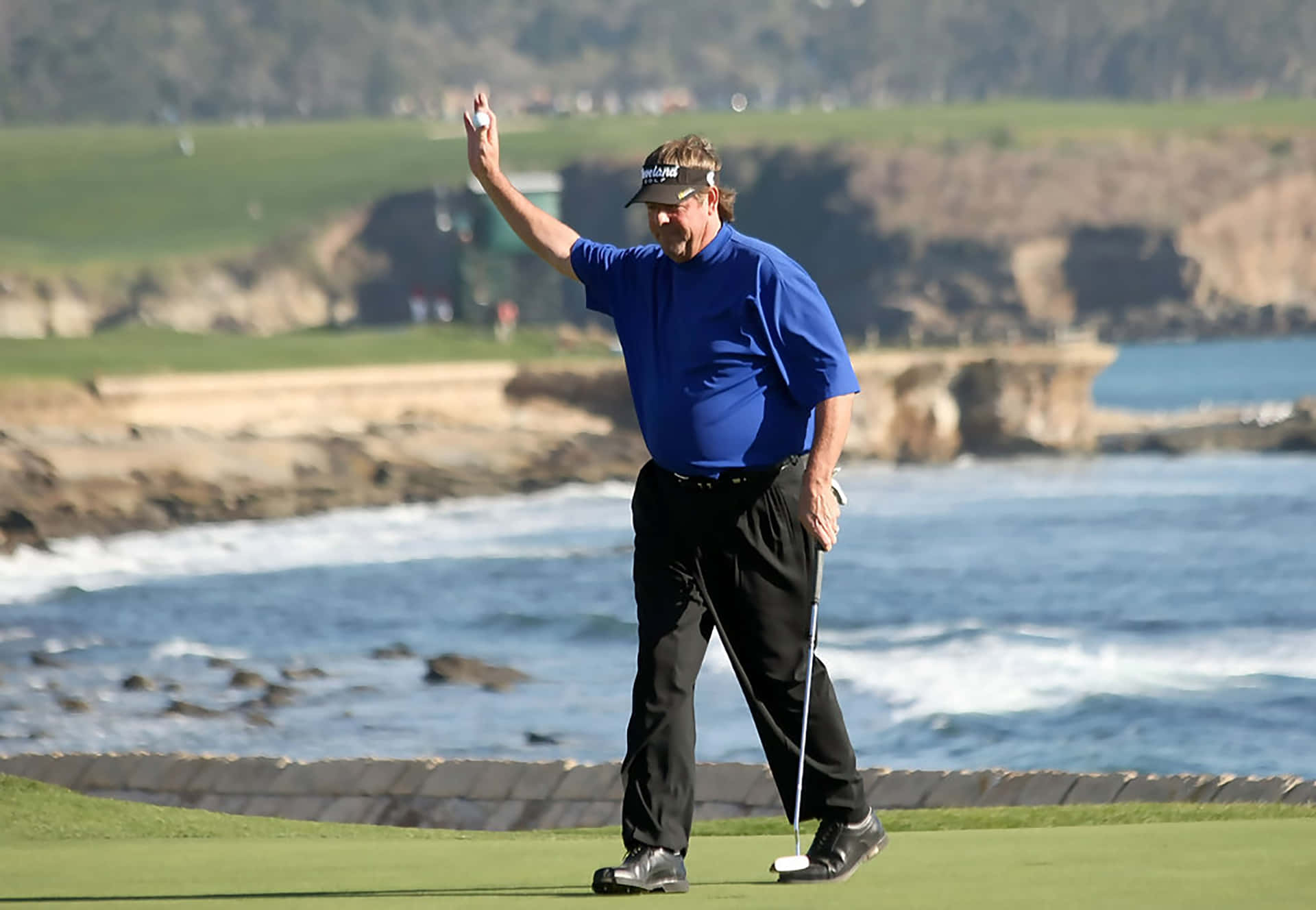 Steve Lowery Holding Up A Golf Ball Wallpaper