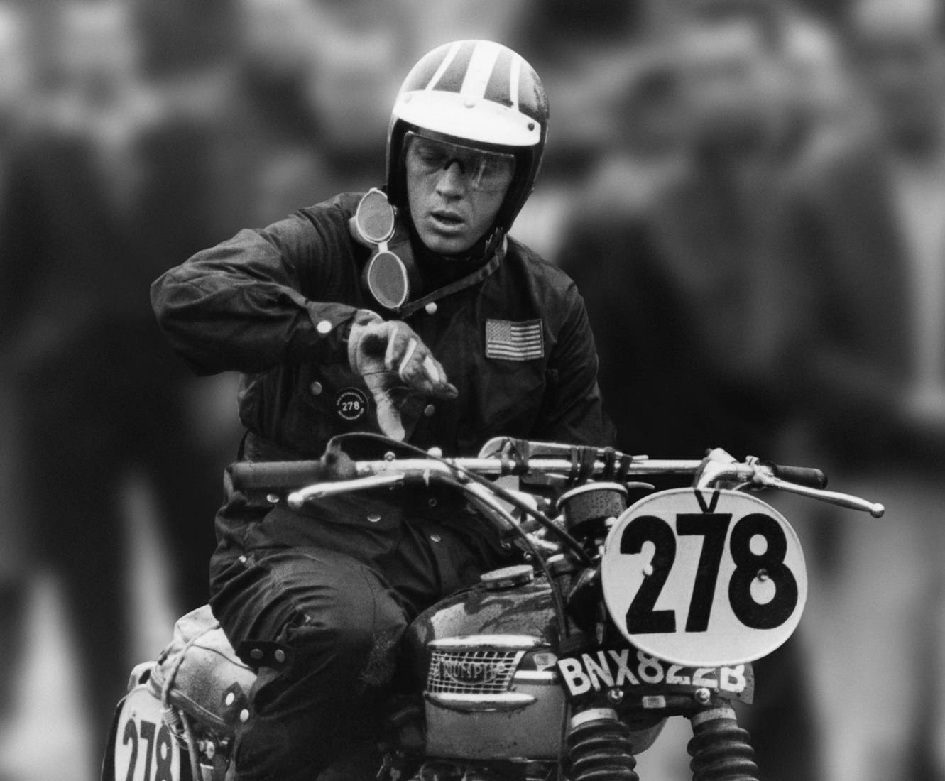 Steve McQueen Riding Motorcycle at 1964 International Six Day Trials. Wallpaper