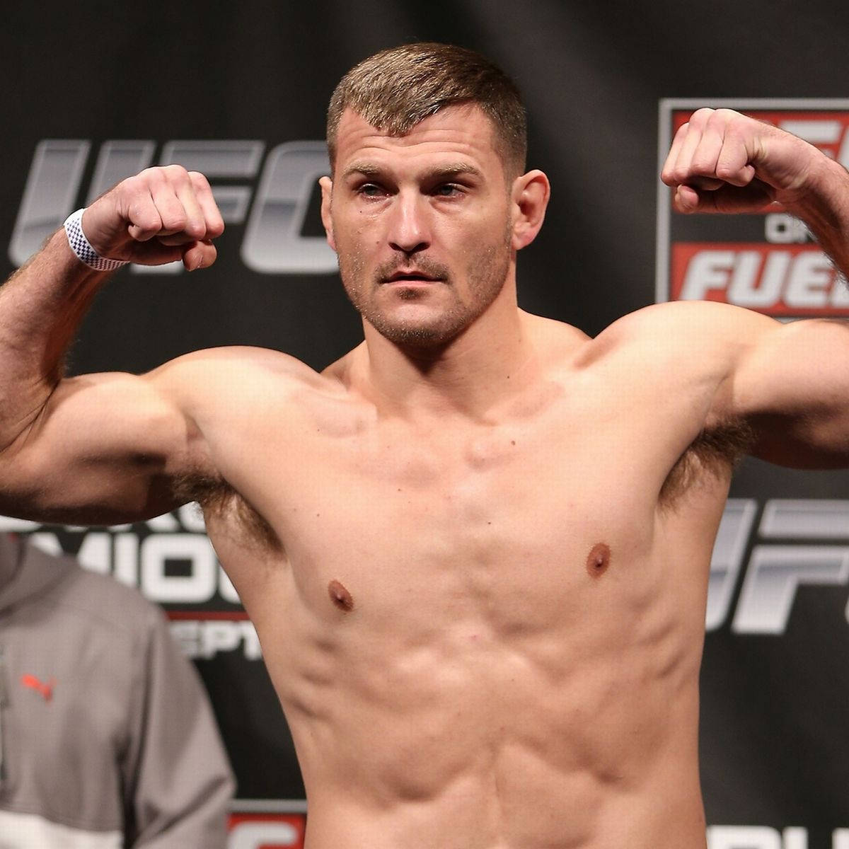 Stipe Miocic Flexing During Weigh-In Wallpaper