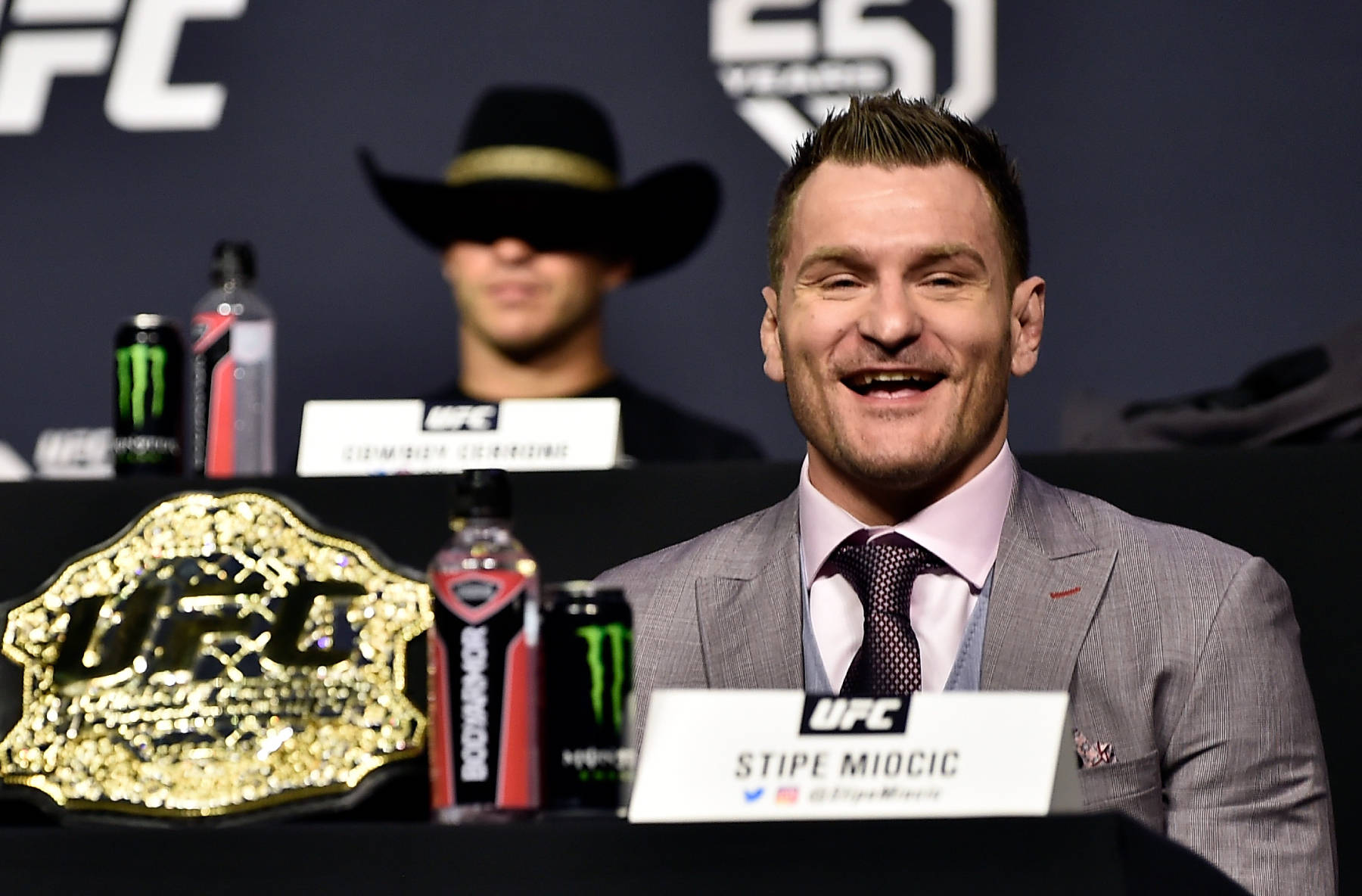 Stipe Miocic Smiling At Conference Wallpaper