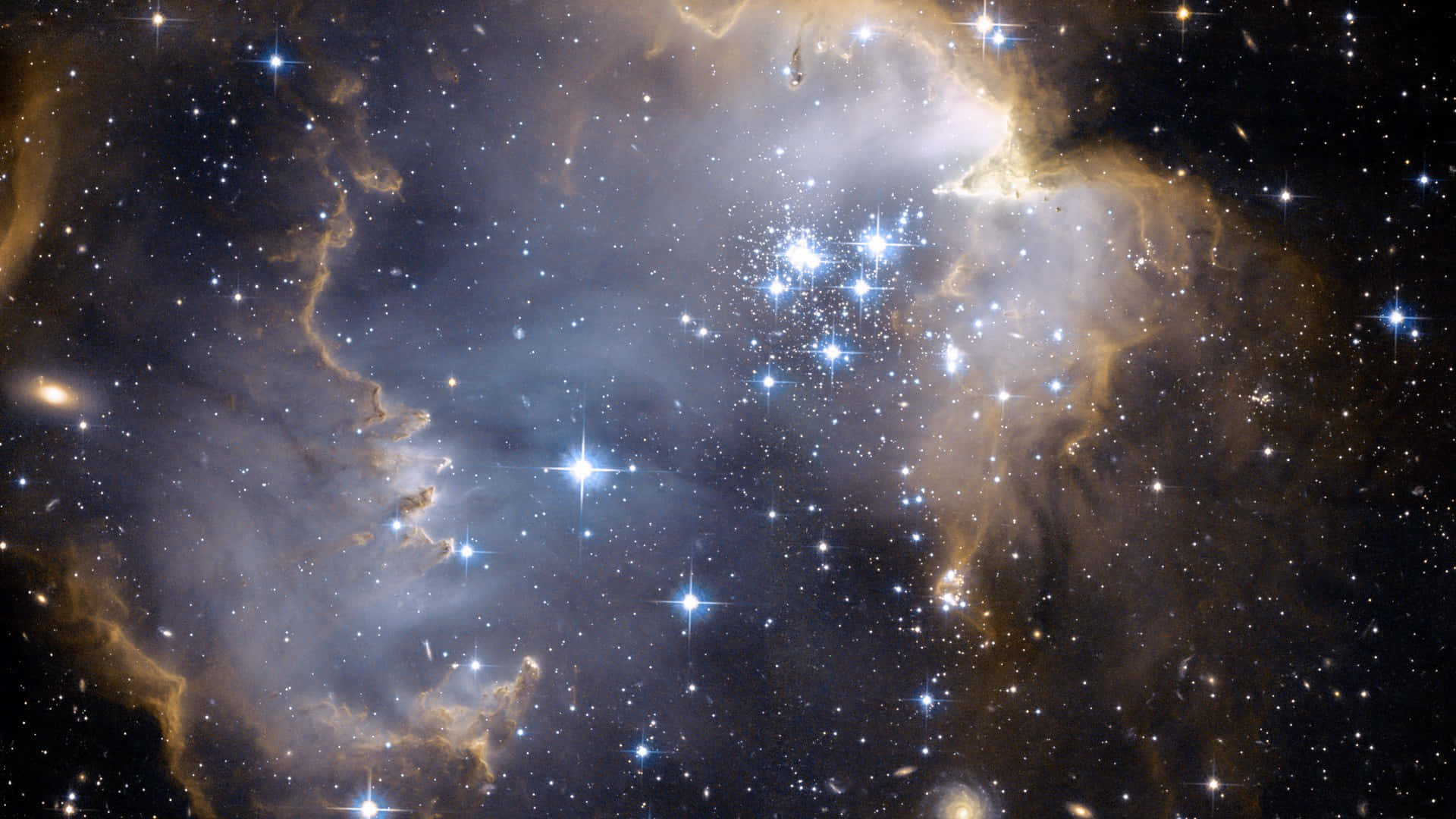 Stjernebilleder glitrer i en dyb mørkeblå baggrund.