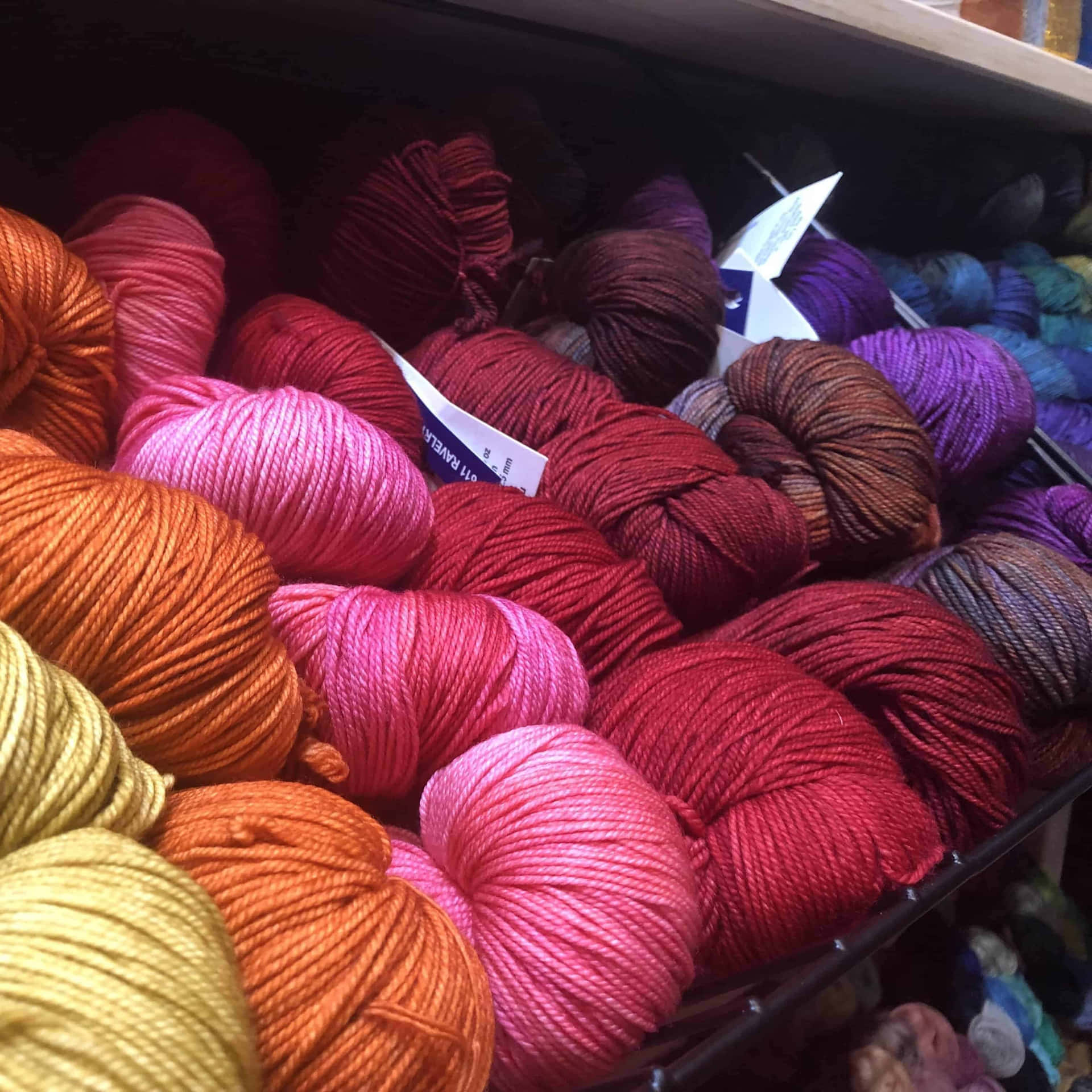 A Diverse Array of Colorful Knitting Wools Wallpaper