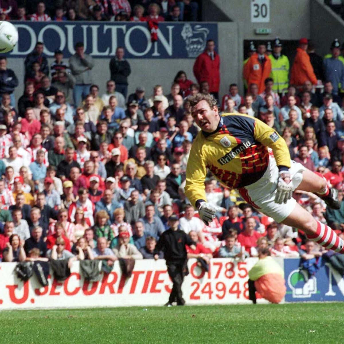 Stoke City Goalkeeper Neville Southall In Action Wallpaper