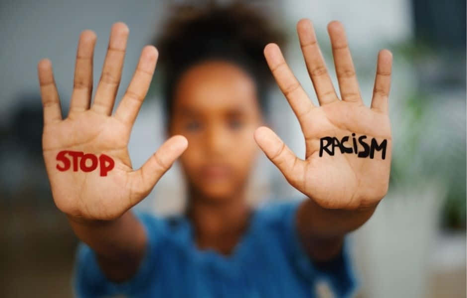 Stop Racism Written On Both Hands Wallpaper